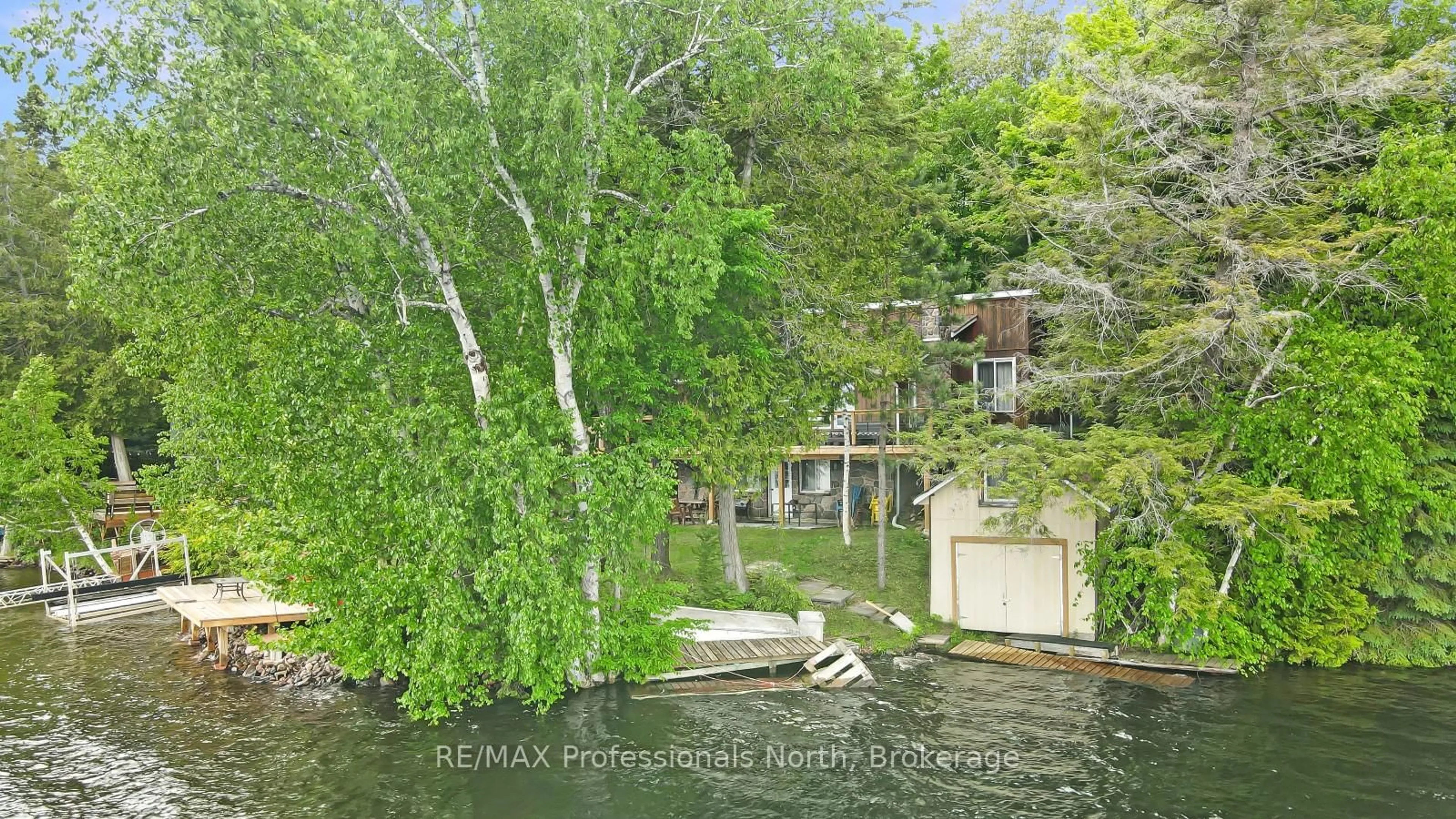 A pic from outside/outdoor area/front of a property/back of a property/a pic from drone, water/lake/river/ocean view for 6198 Haliburton Lake Rd, Dysart et al Ontario K0M 1S0