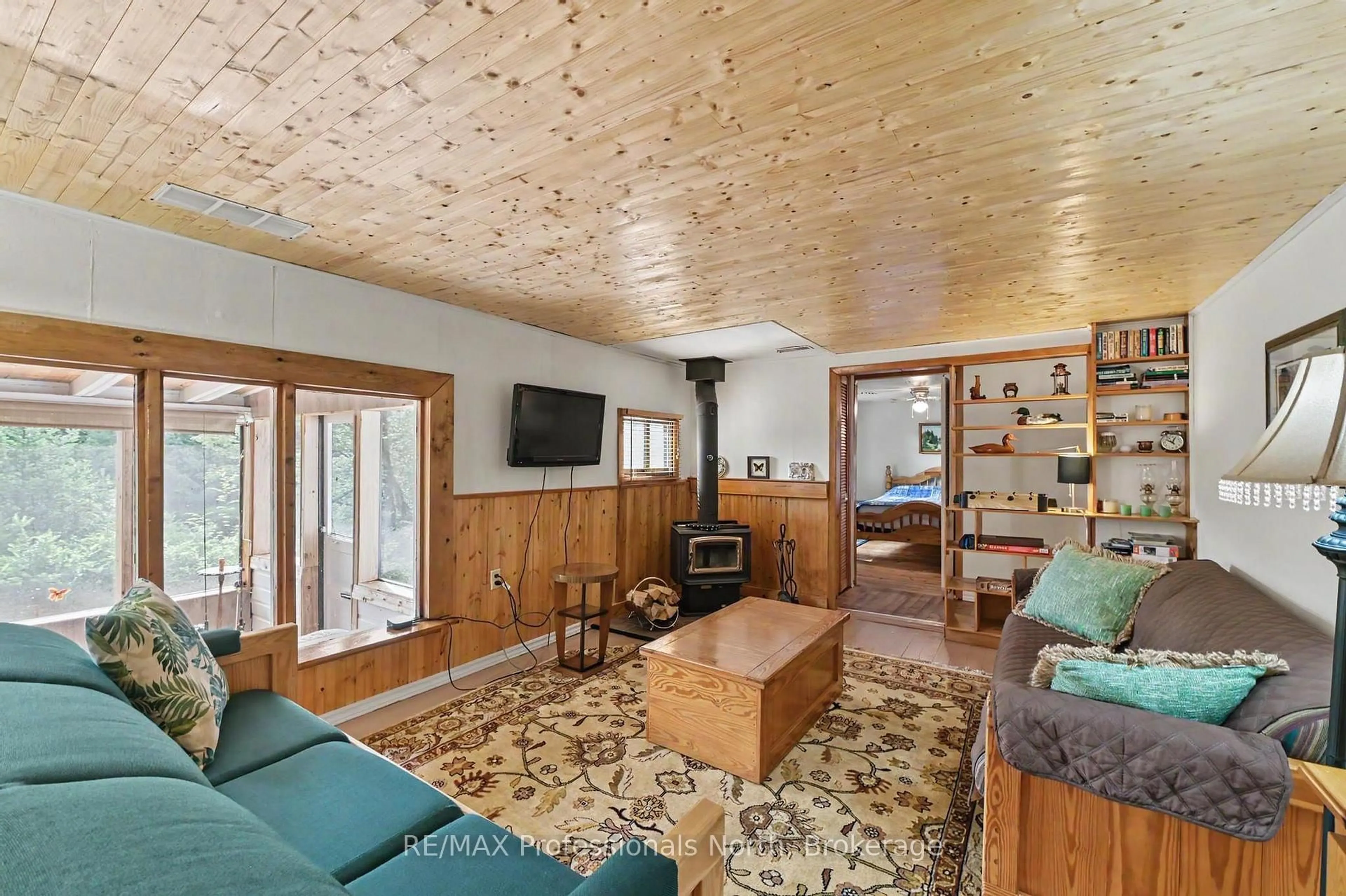 Living room with furniture, wood/laminate floor for 3701 Gelert Rd, Minden Hills Ontario K0M 2K0