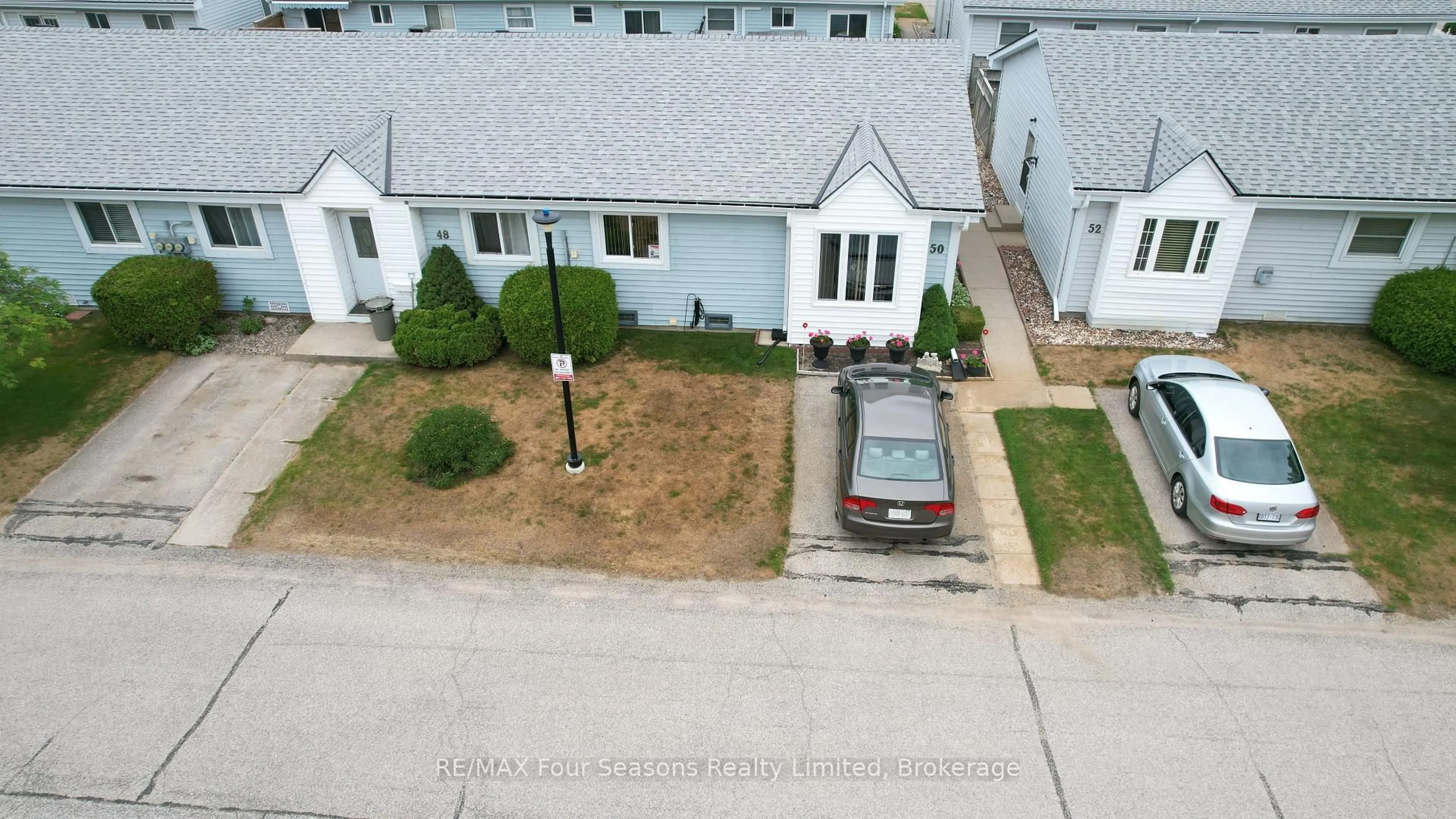 A pic from outside/outdoor area/front of a property/back of a property/a pic from drone, street for 303 Waterloo St #52, Saugeen Shores Ontario N0H 2C1
