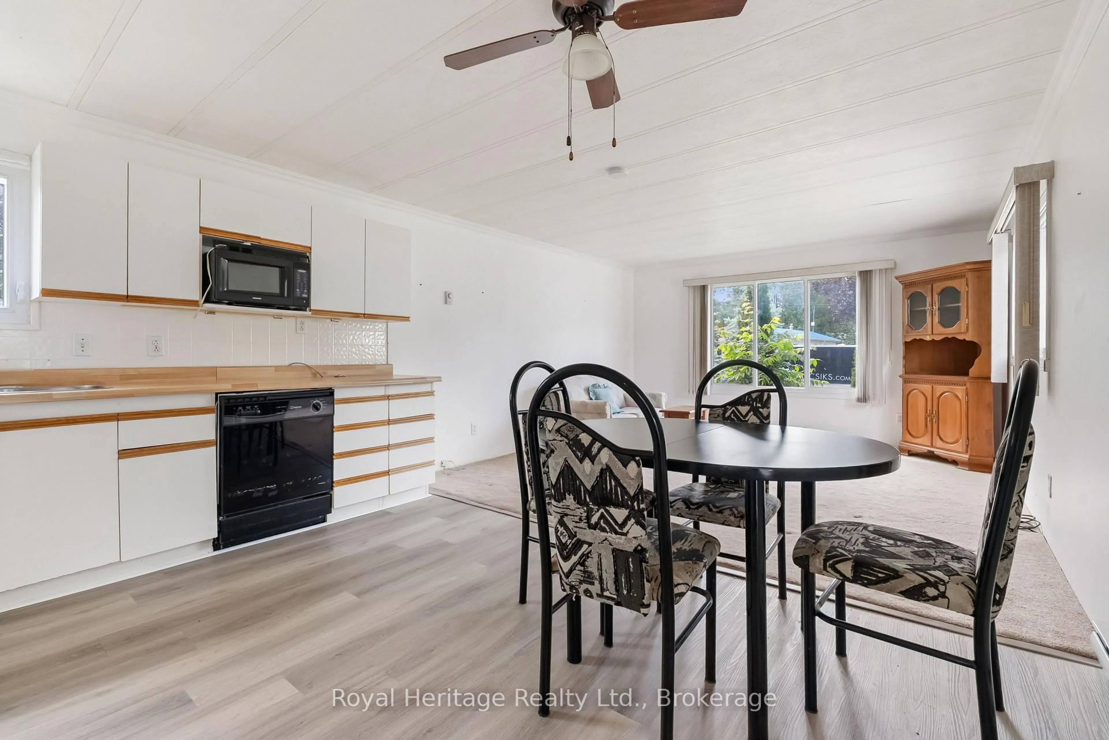 Open concept kitchen, wood/laminate floor for 19 Park Cres, Kawartha Lakes Ontario K9V 4R3