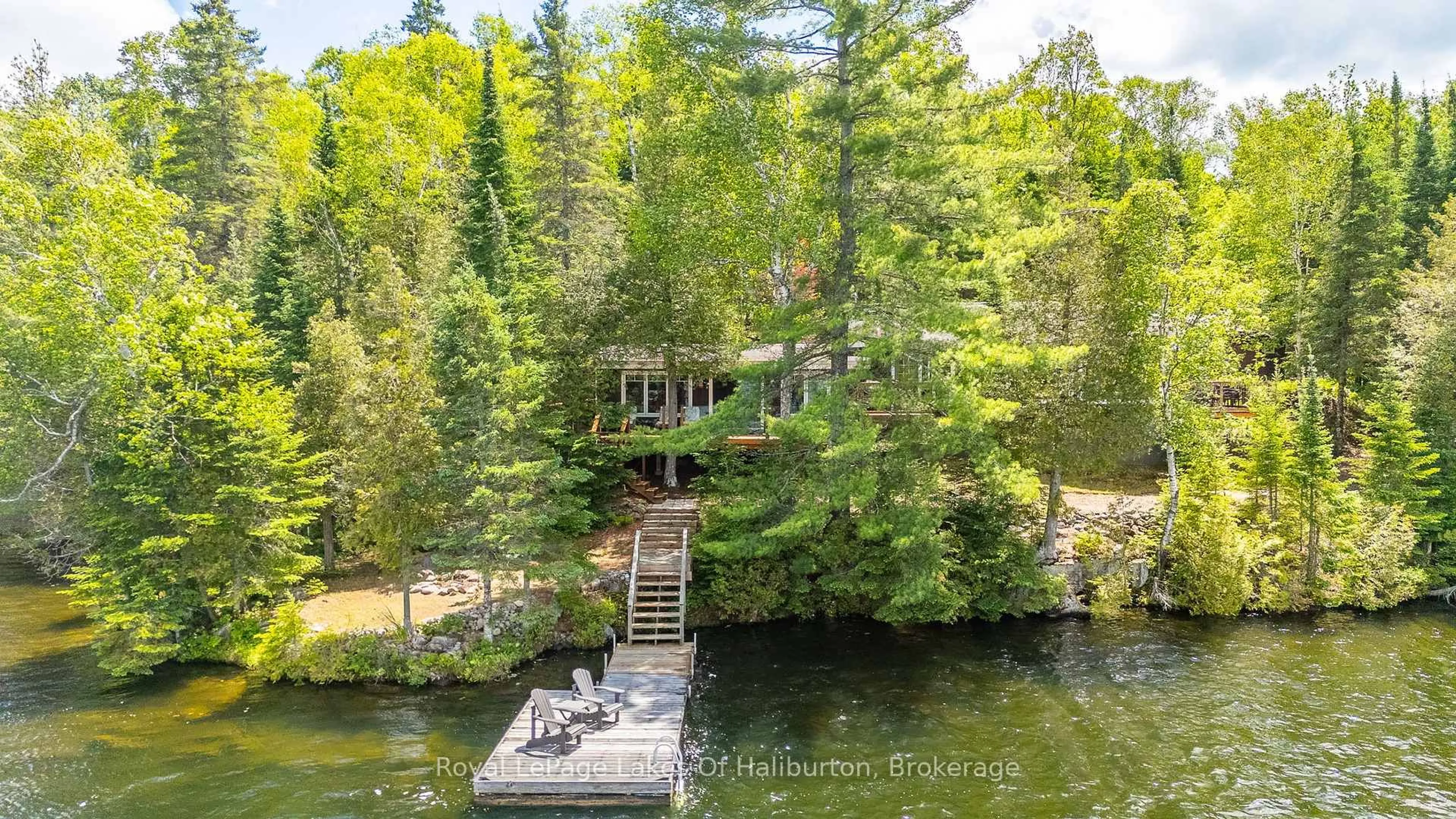 A pic from outside/outdoor area/front of a property/back of a property/a pic from drone, water/lake/river/ocean view for 1270 Quartz Lane, Highlands East Ontario K0M 1R0