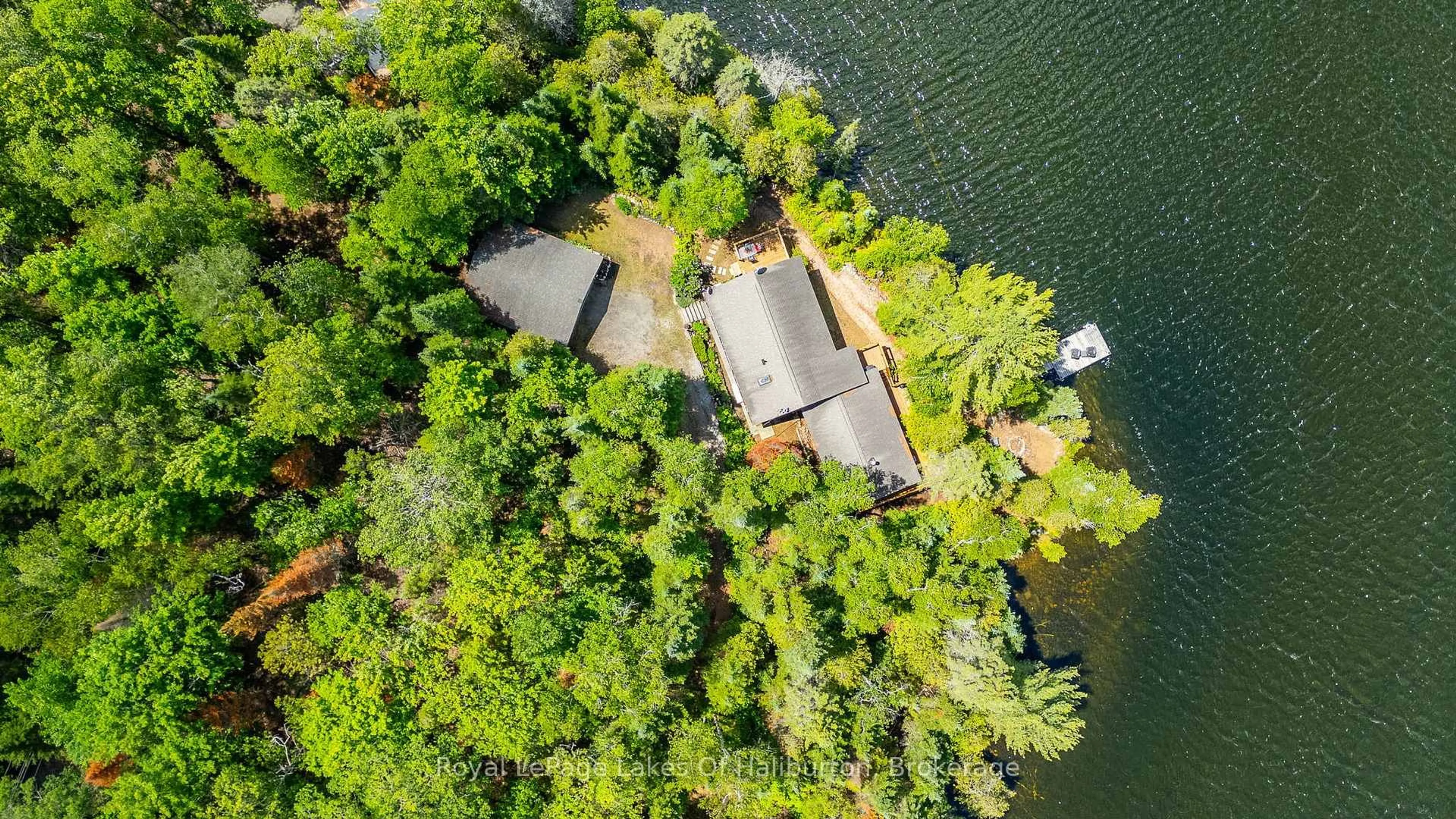 A pic from outside/outdoor area/front of a property/back of a property/a pic from drone, water/lake/river/ocean view for 1270 Quartz Lane, Highlands East Ontario K0M 1R0