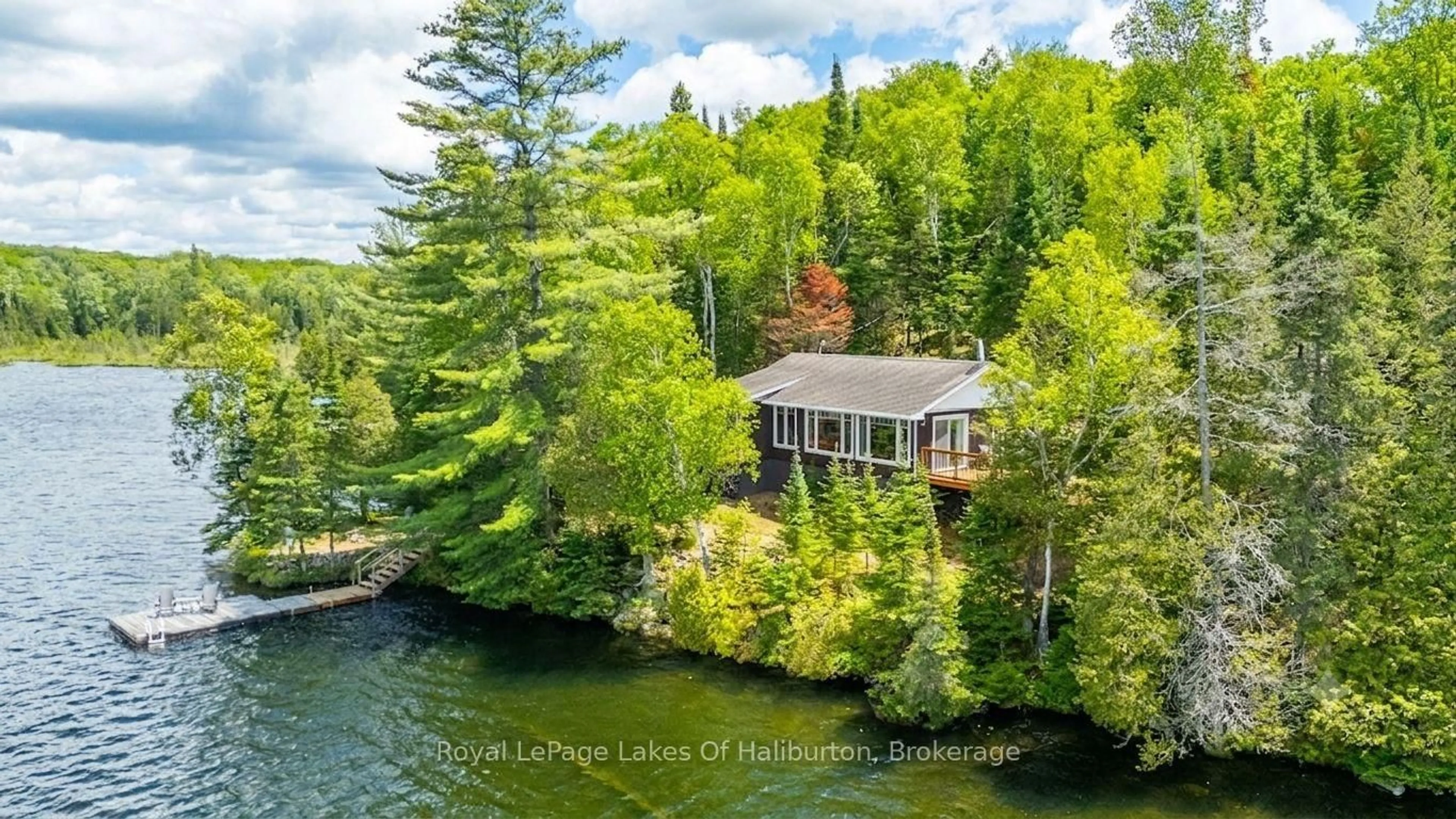 A pic from outside/outdoor area/front of a property/back of a property/a pic from drone, water/lake/river/ocean view for 1270 Quartz Lane, Highlands East Ontario K0M 1R0