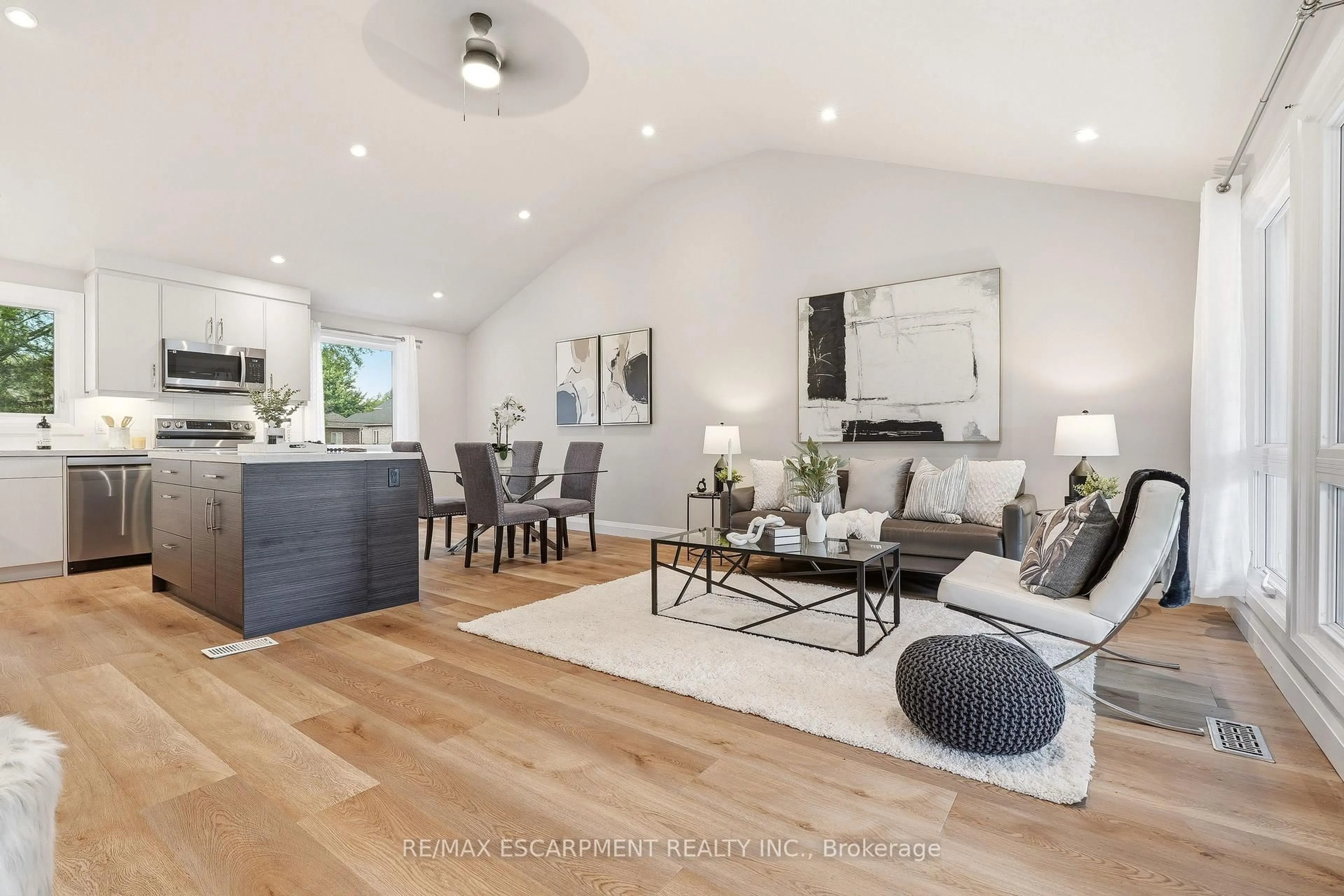 Living room with furniture, wood/laminate floor for 99 Byron Ave, Hamilton Ontario L8J 2T2