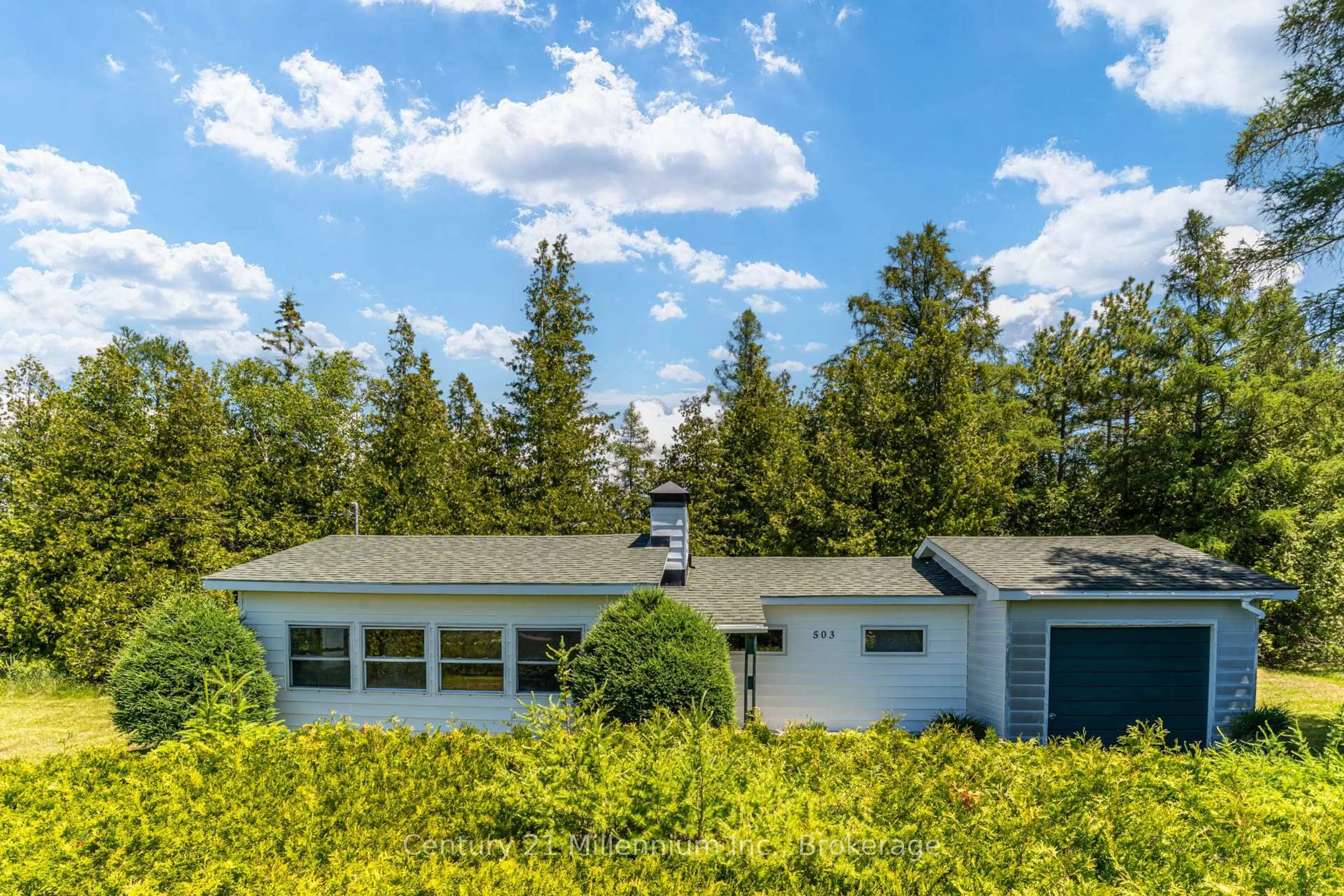 Home with vinyl exterior material, forest/trees view for 503 Bay St, South Bruce Peninsula Ontario N0H 2T0