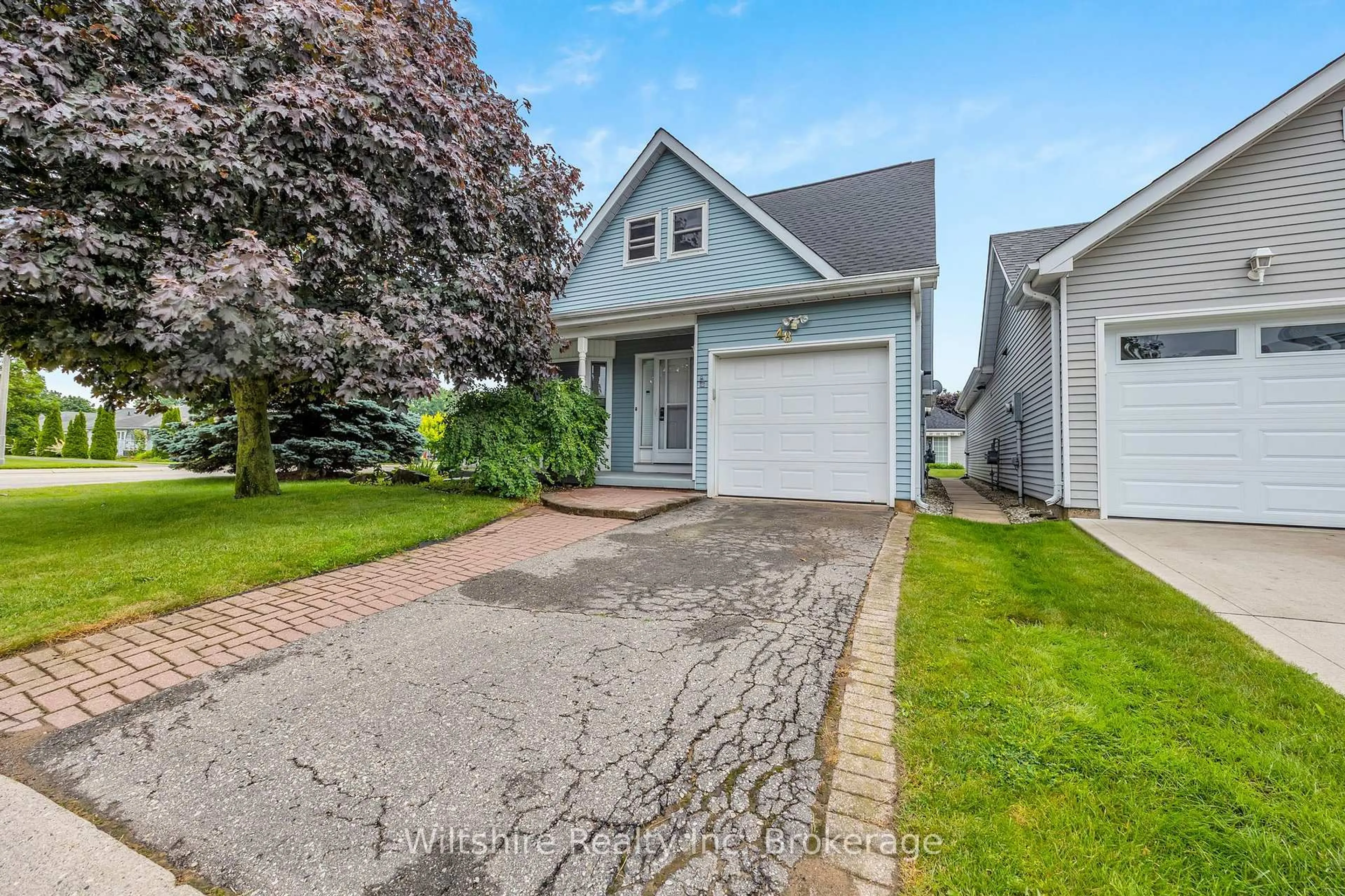 Home with vinyl exterior material, street for 48 Sinclair Dr, Tillsonburg Ontario N4G 5L8