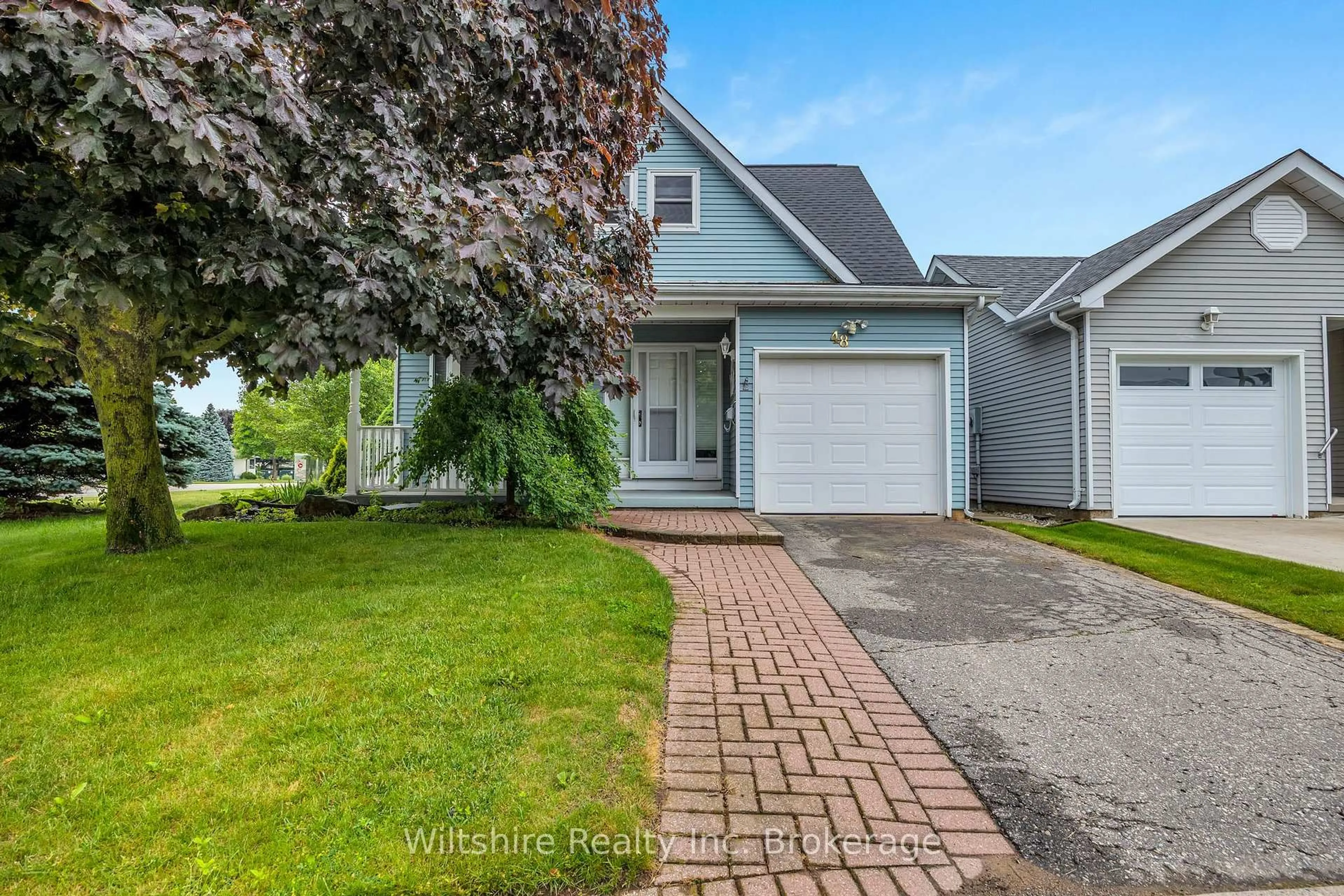 Home with vinyl exterior material, street for 48 Sinclair Dr, Tillsonburg Ontario N4G 5L8