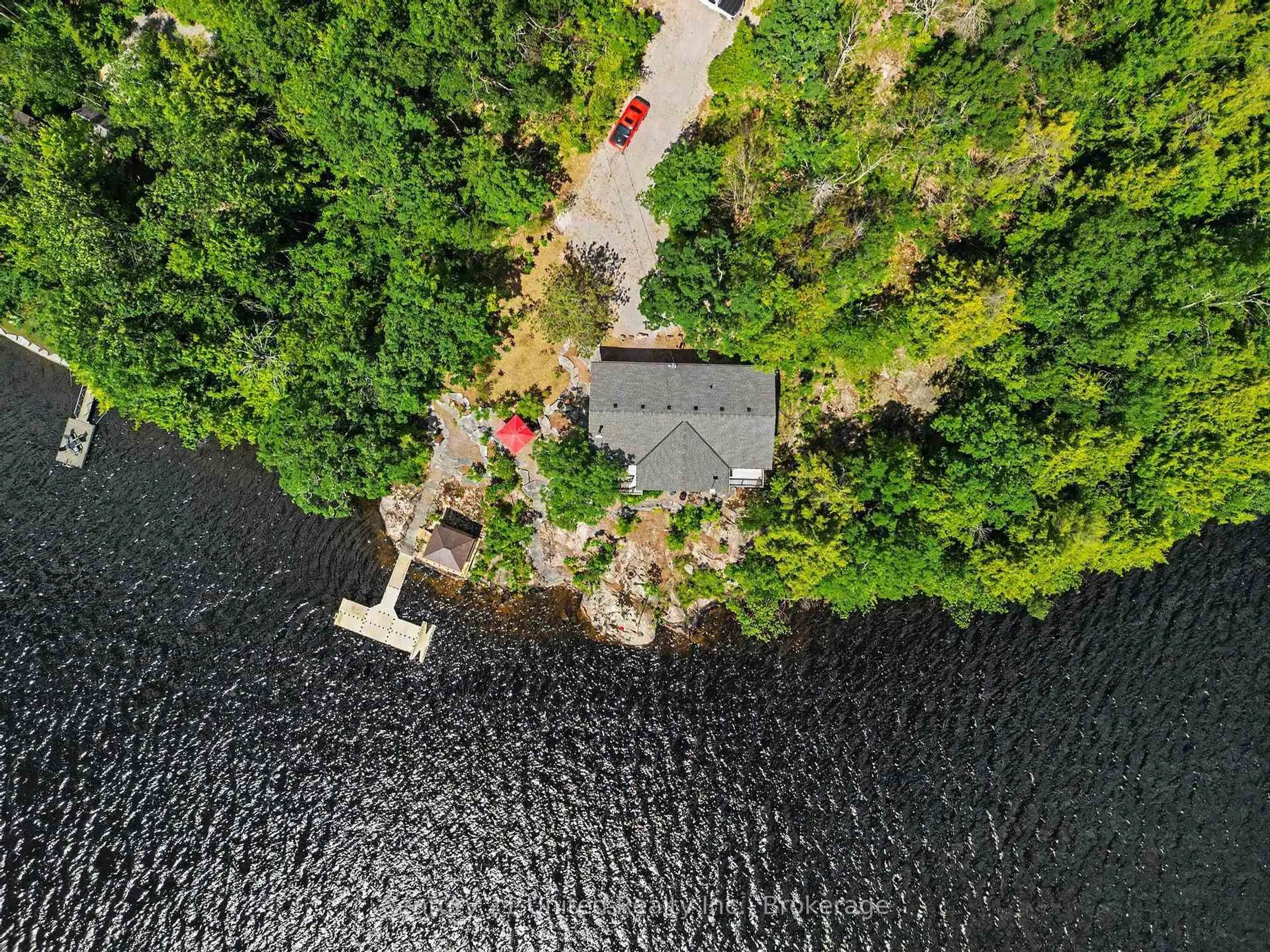 A pic from outside/outdoor area/front of a property/back of a property/a pic from drone, water/lake/river/ocean view for 36 Fire Route 141, Trent Lakes Ontario K0L 1J0