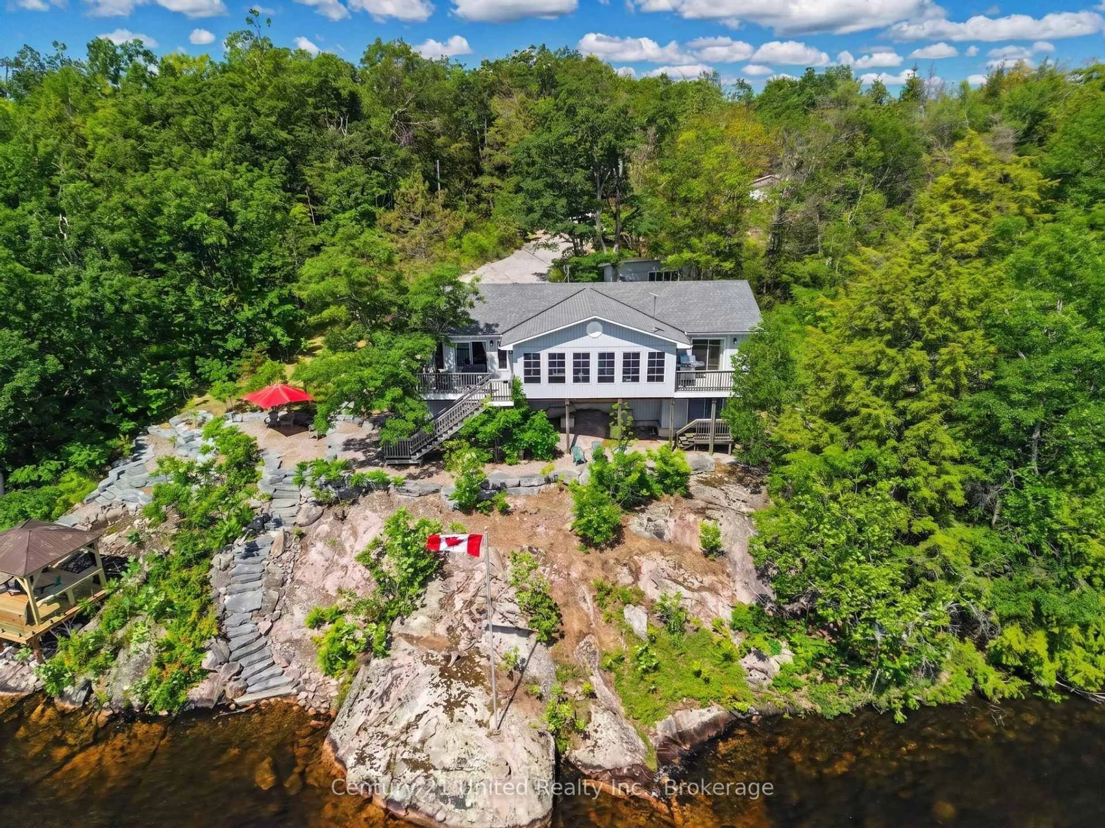 A pic from outside/outdoor area/front of a property/back of a property/a pic from drone, water/lake/river/ocean view for 36 Fire Route 141, Trent Lakes Ontario K0L 1J0