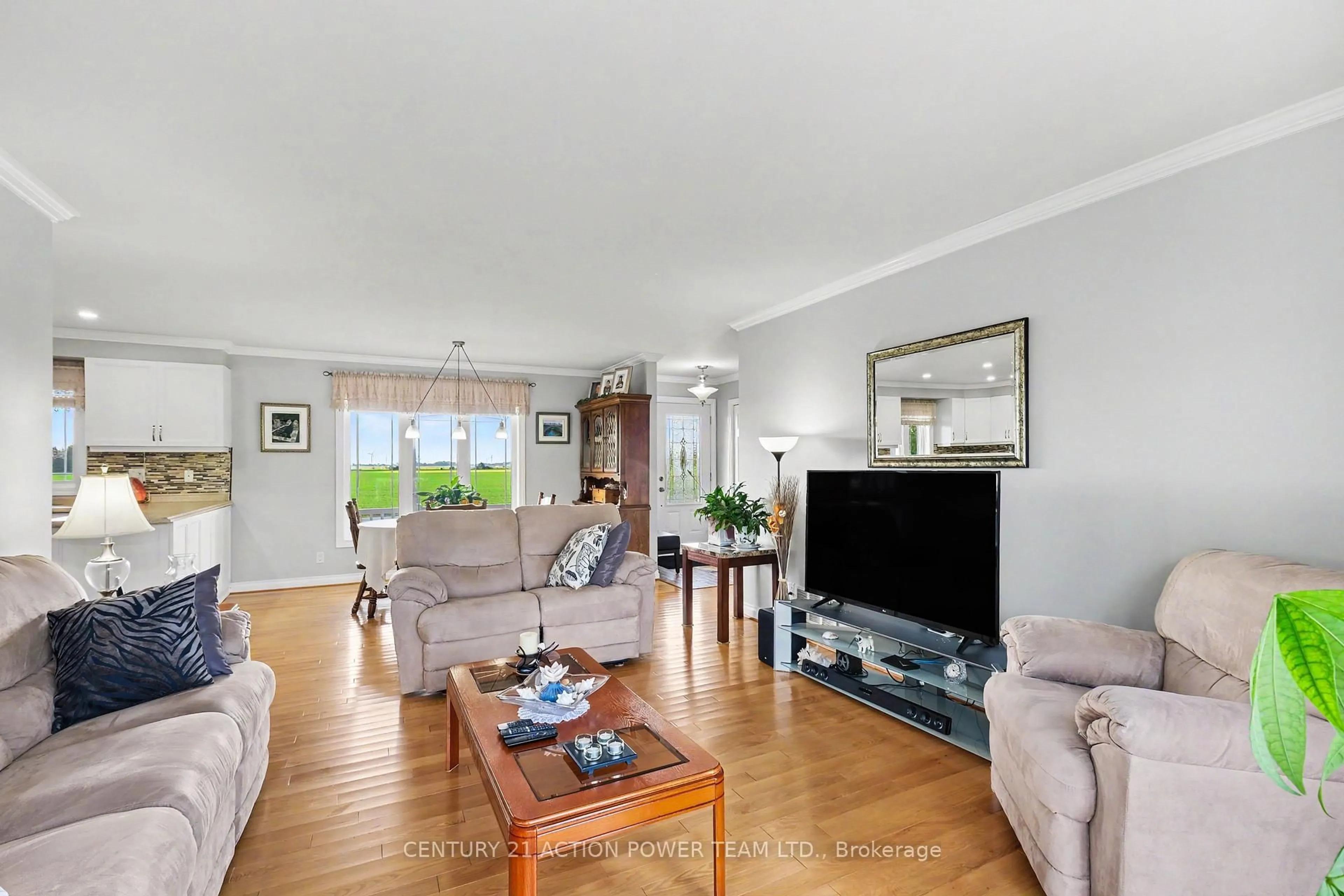 Living room with furniture, wood/laminate floor for 19 Crysler Station Rd, North Stormont Ontario K0A 1R0