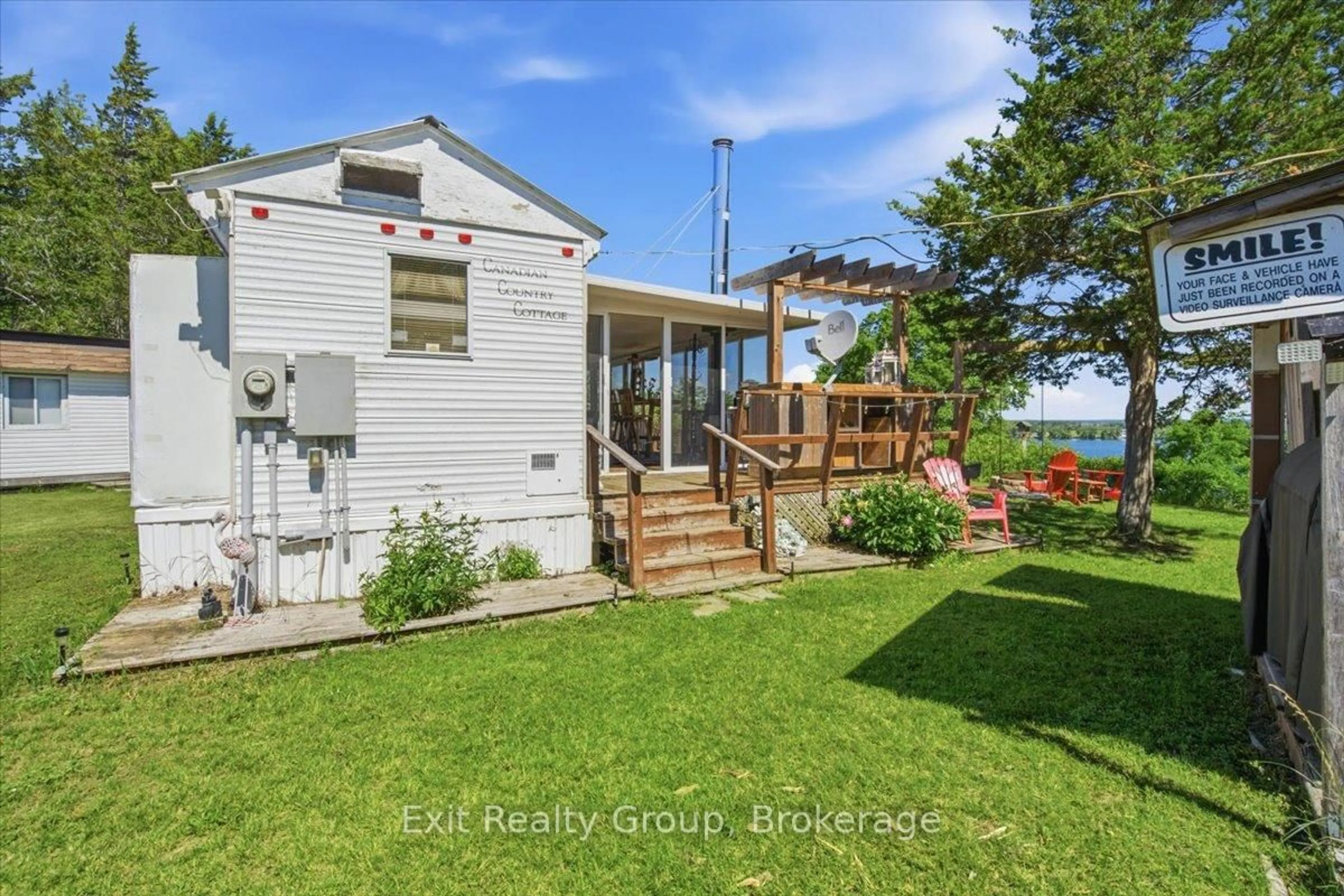 A pic from outside/outdoor area/front of a property/back of a property/a pic from drone, water/lake/river/ocean view for 1154 County Rd 14, Prince Edward County Ontario K0K 1W0