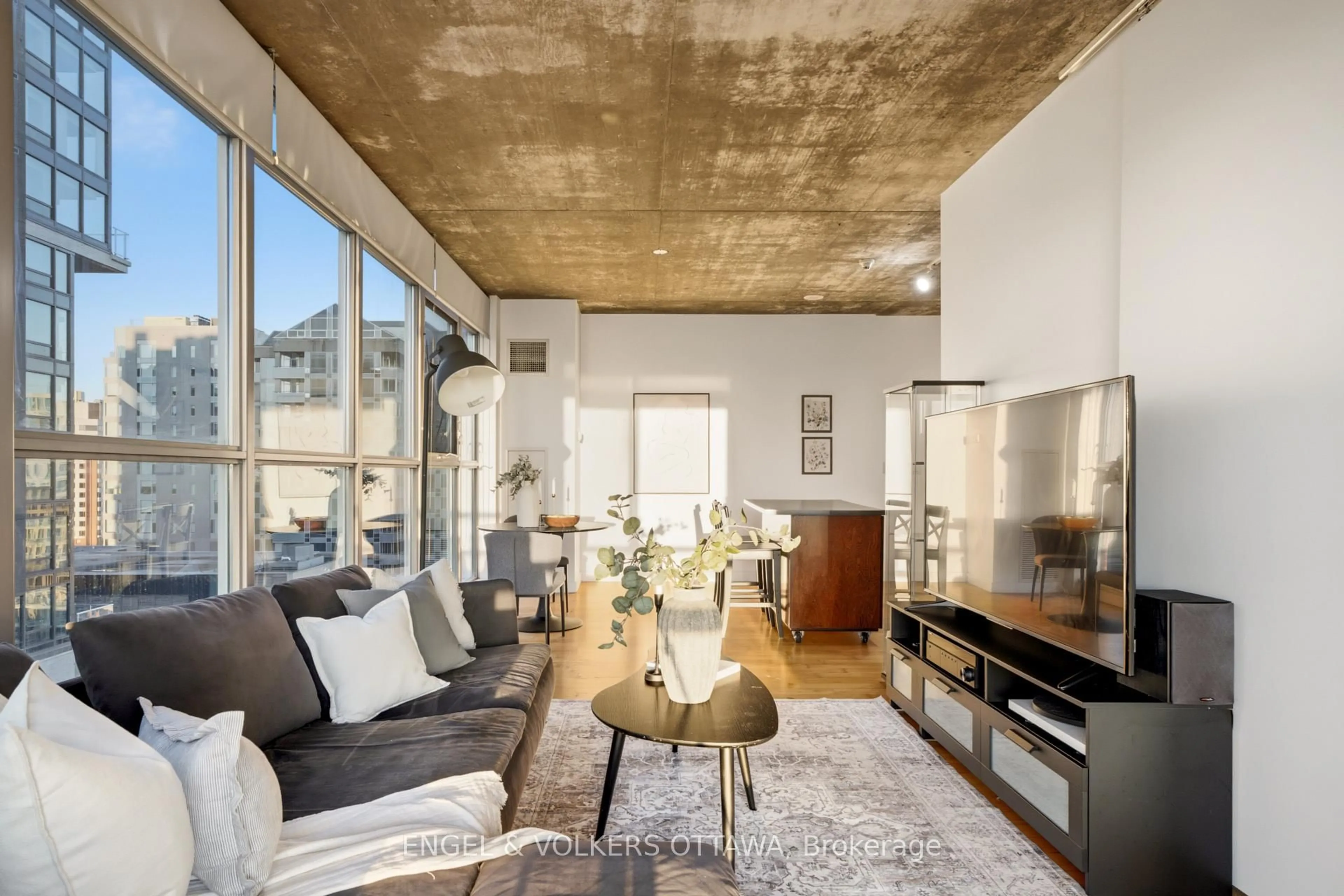 Living room with furniture, cement floor for 179 George St #1903, Ottawa Ontario K1N 1J8