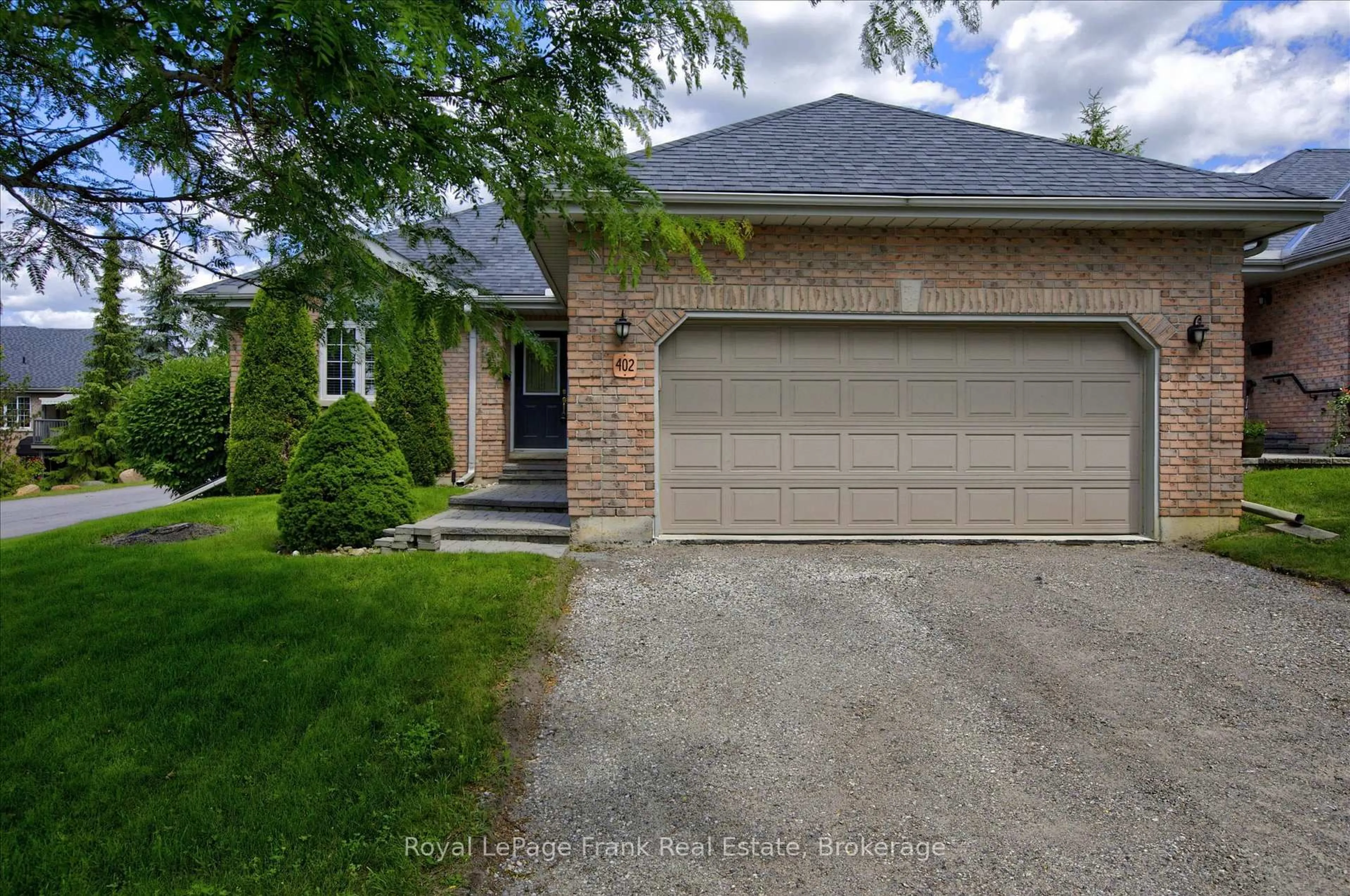 Home with brick exterior material, street for 1742 Ravenwood Dr #402, Peterborough Ontario K9K 2R5
