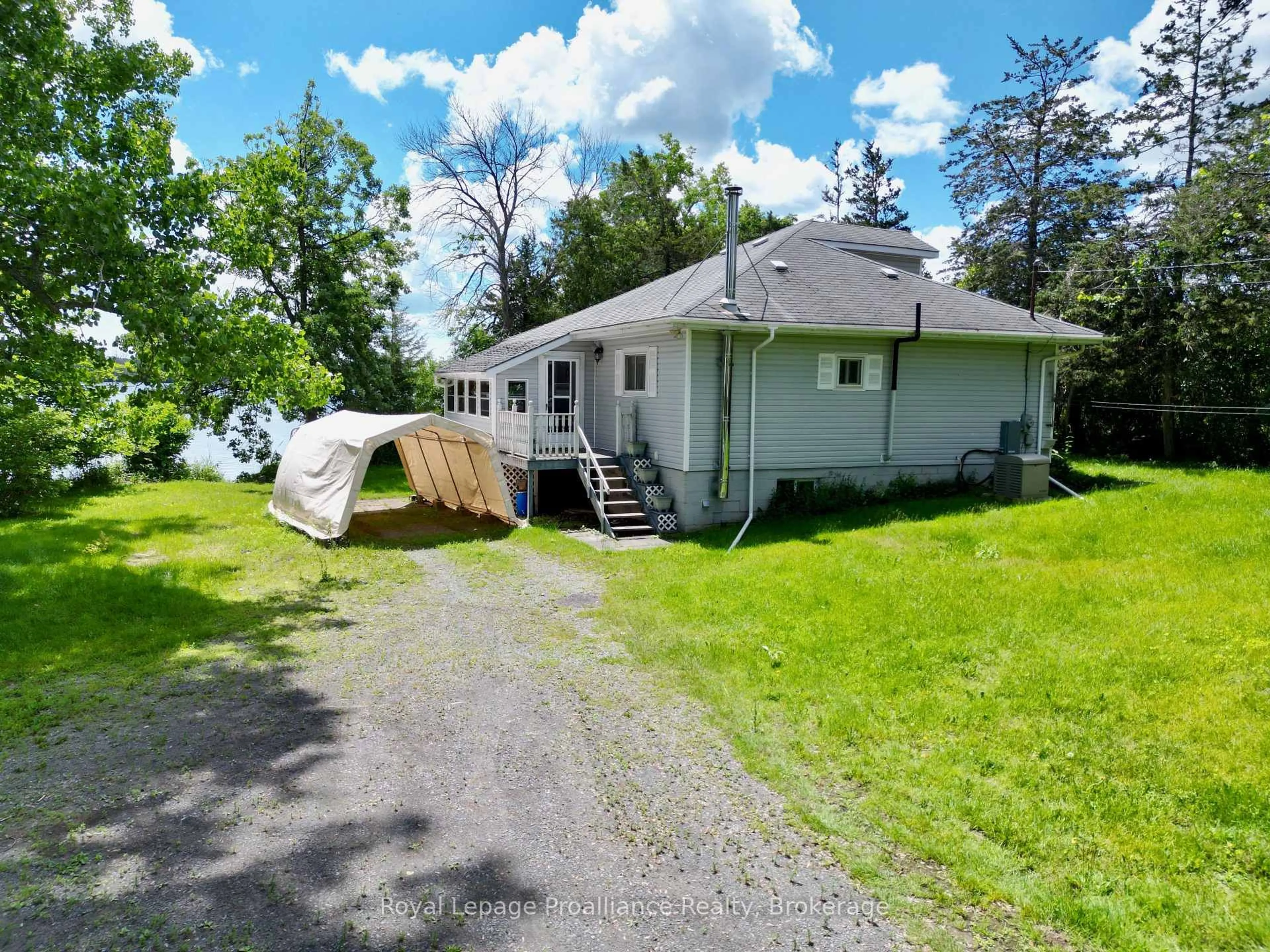 A pic from outside/outdoor area/front of a property/back of a property/a pic from drone, water/lake/river/ocean view for 473 County Rd 19 St, Prince Edward County Ontario K0K 2T0
