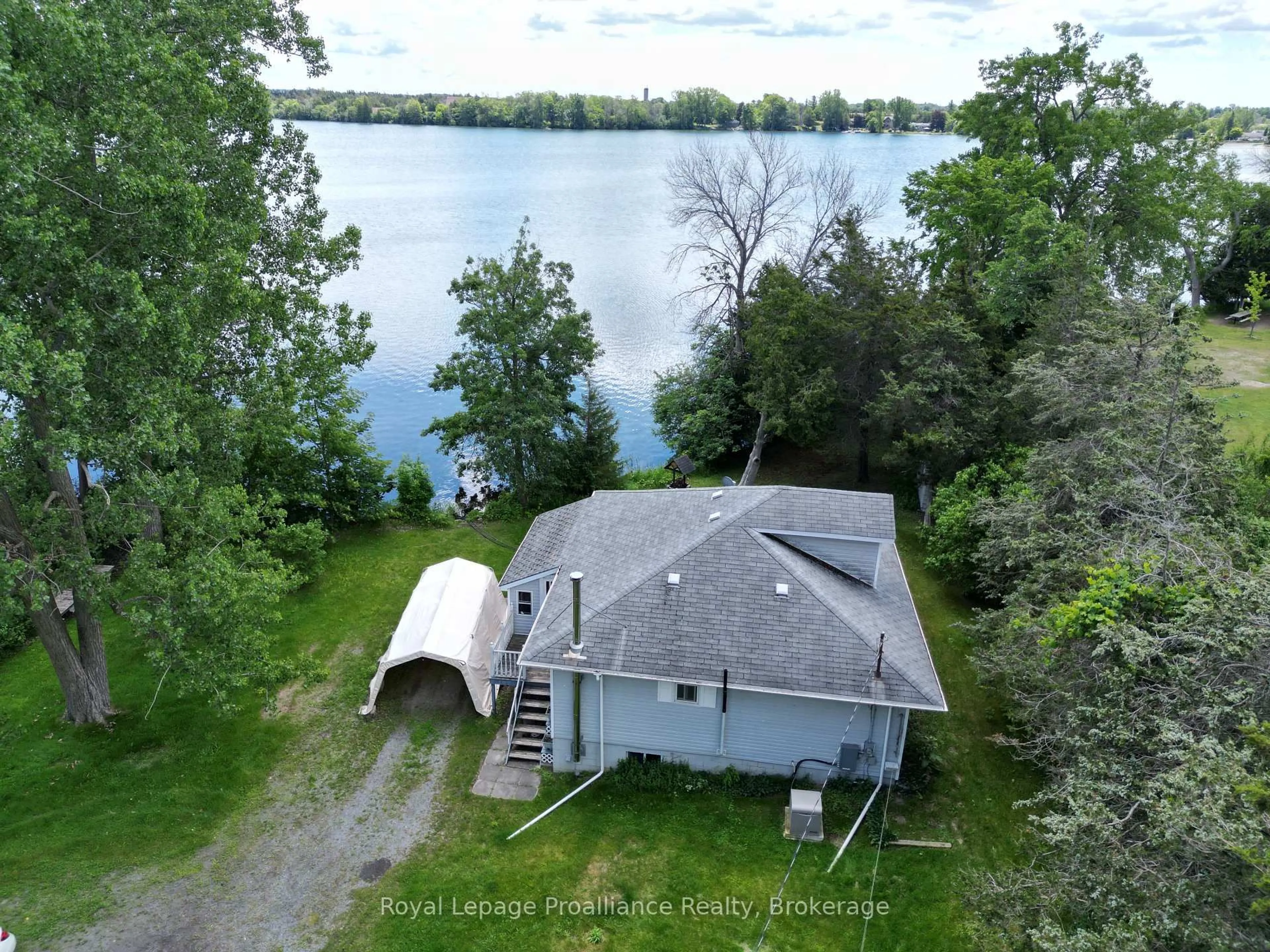 A pic from outside/outdoor area/front of a property/back of a property/a pic from drone, water/lake/river/ocean view for 473 County Rd 19 St, Prince Edward County Ontario K0K 2T0
