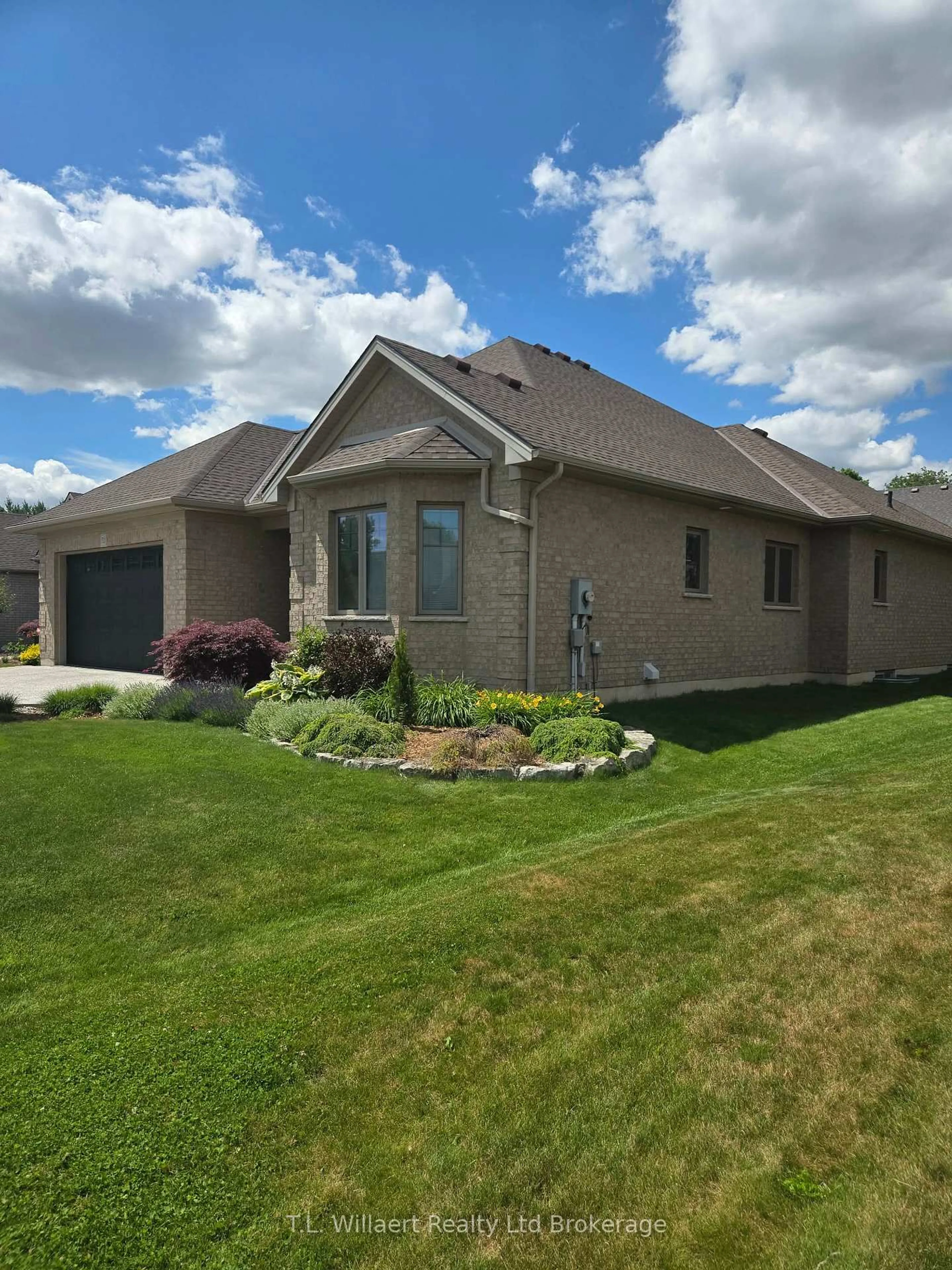 Home with brick exterior material, street for 50 Wood Haven Dr, Tillsonburg Ontario N4G 0A5