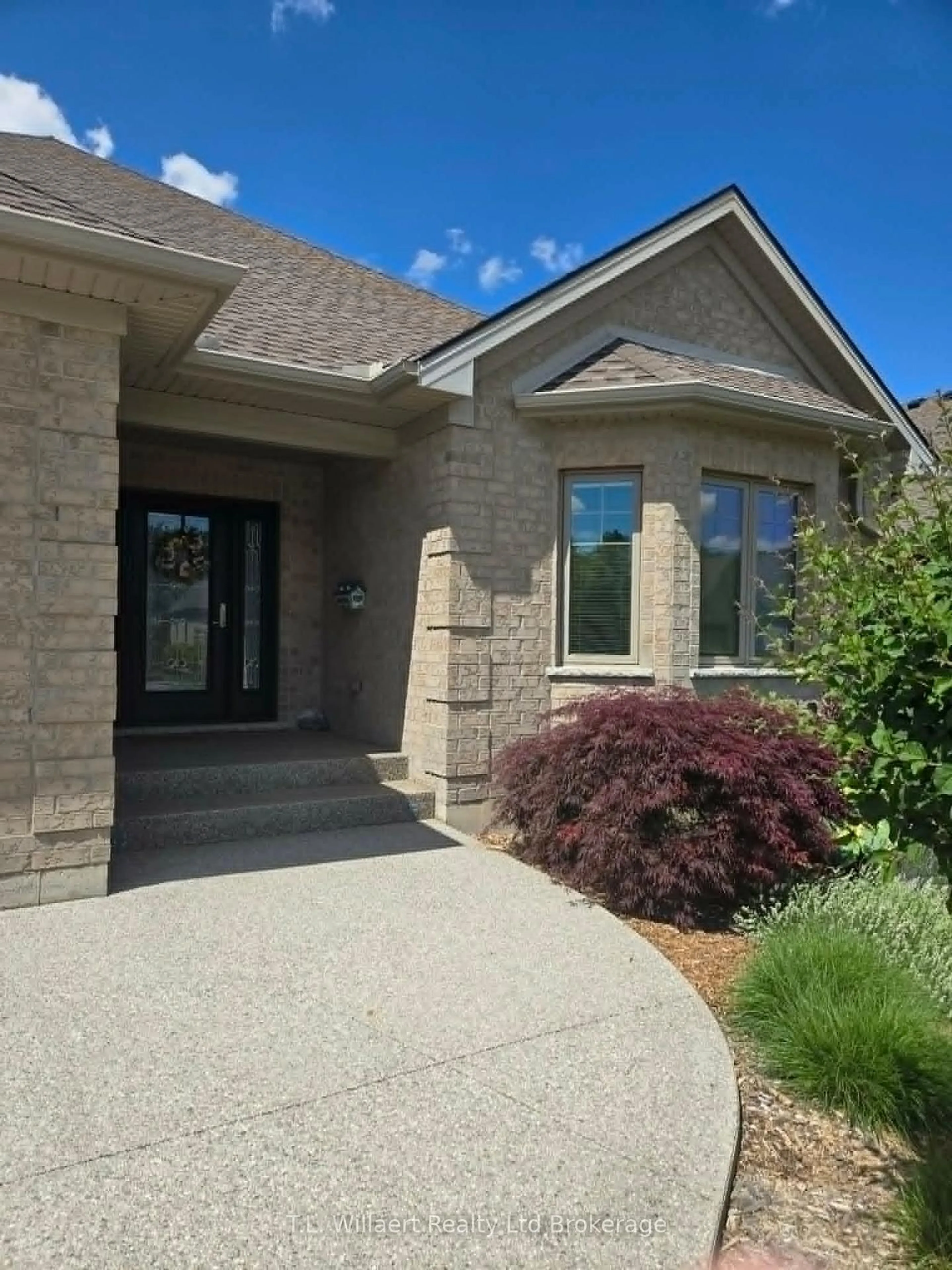 Home with brick exterior material, street for 50 Wood Haven Dr, Tillsonburg Ontario N4G 0A5