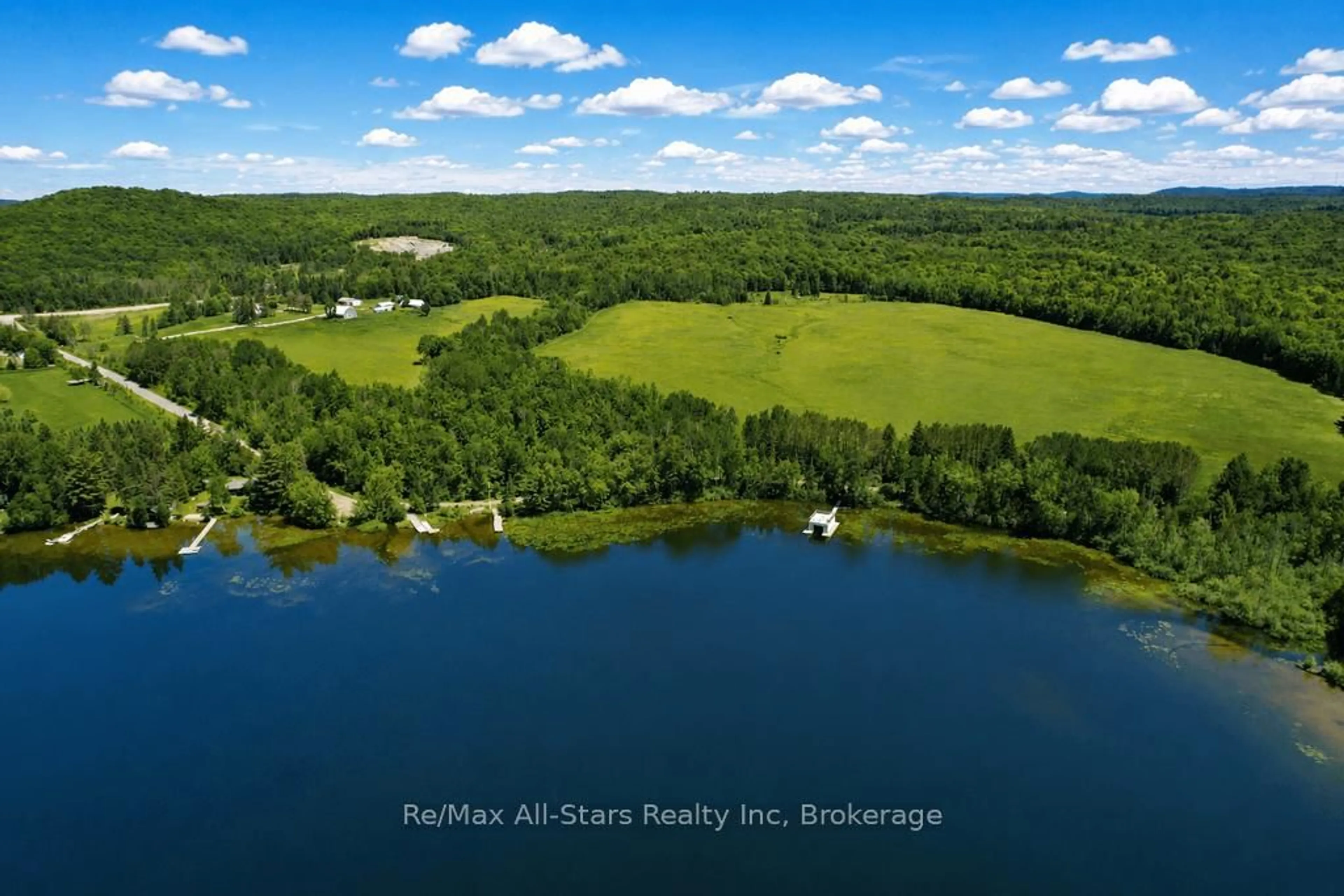 A pic from outside/outdoor area/front of a property/back of a property/a pic from drone, water/lake/river/ocean view for 2383 60 Highway, Lake of Bays Ontario P1H 2E5
