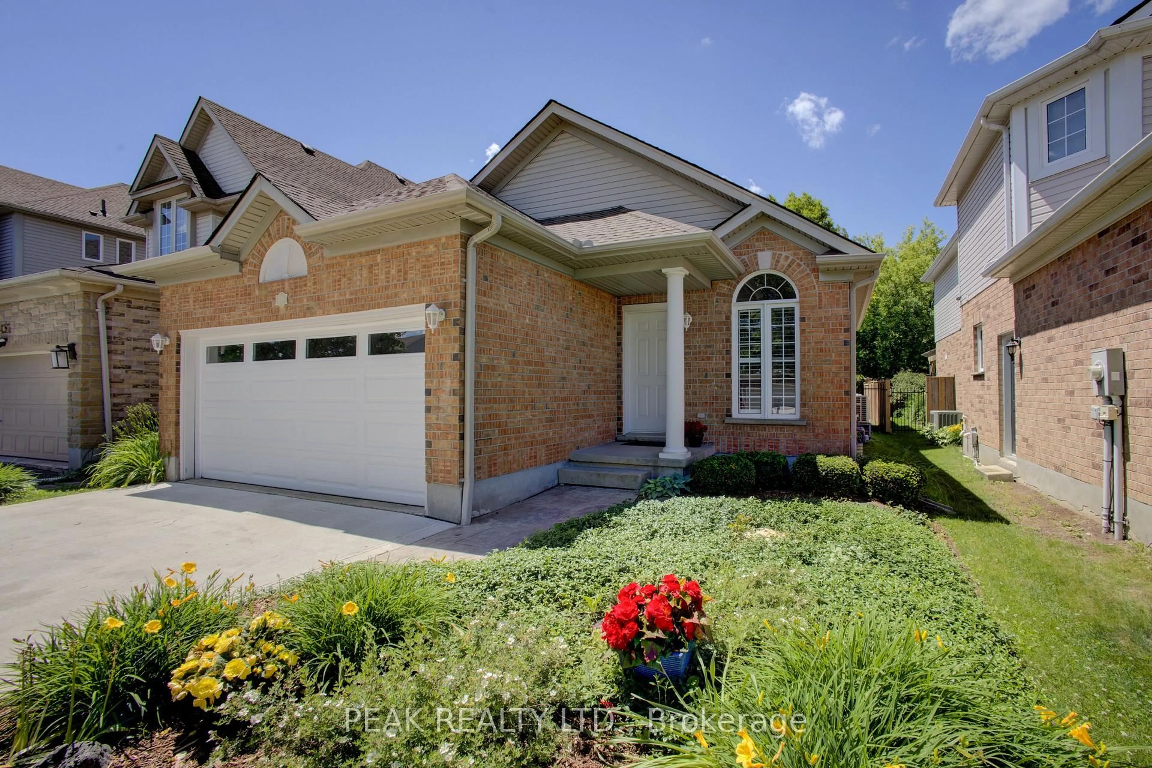 Home with brick exterior material, street for 439 Woodrow Dr, Waterloo Ontario N2T 2V6