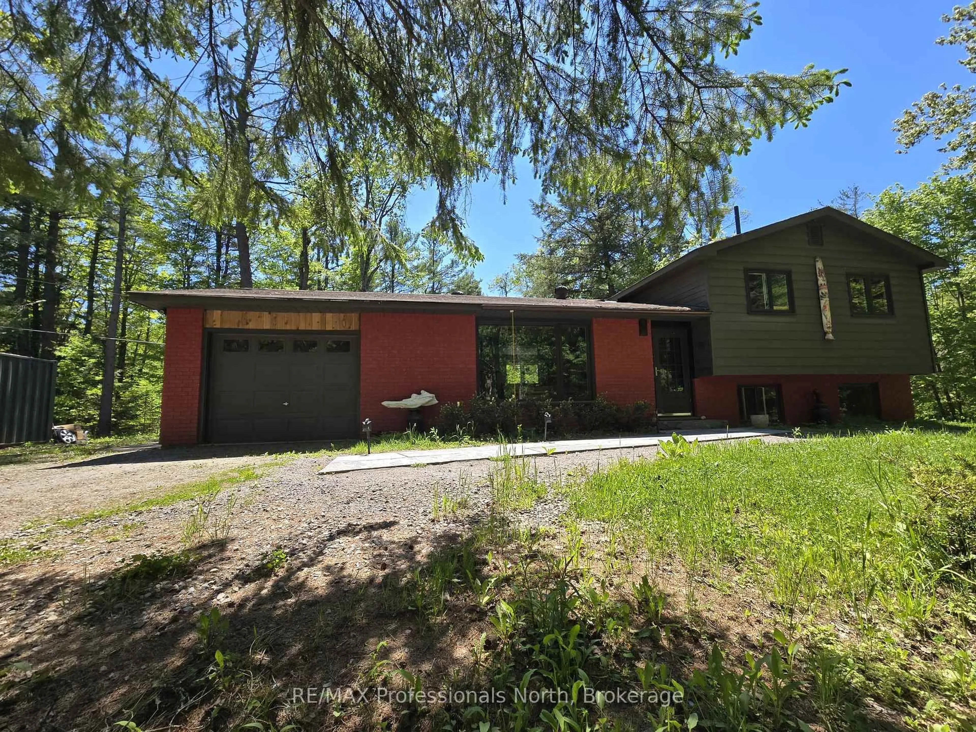 A pic from outside/outdoor area/front of a property/back of a property/a pic from drone, forest/trees view for 1460 Peterson Rd, Bracebridge Ontario P1L 1X1