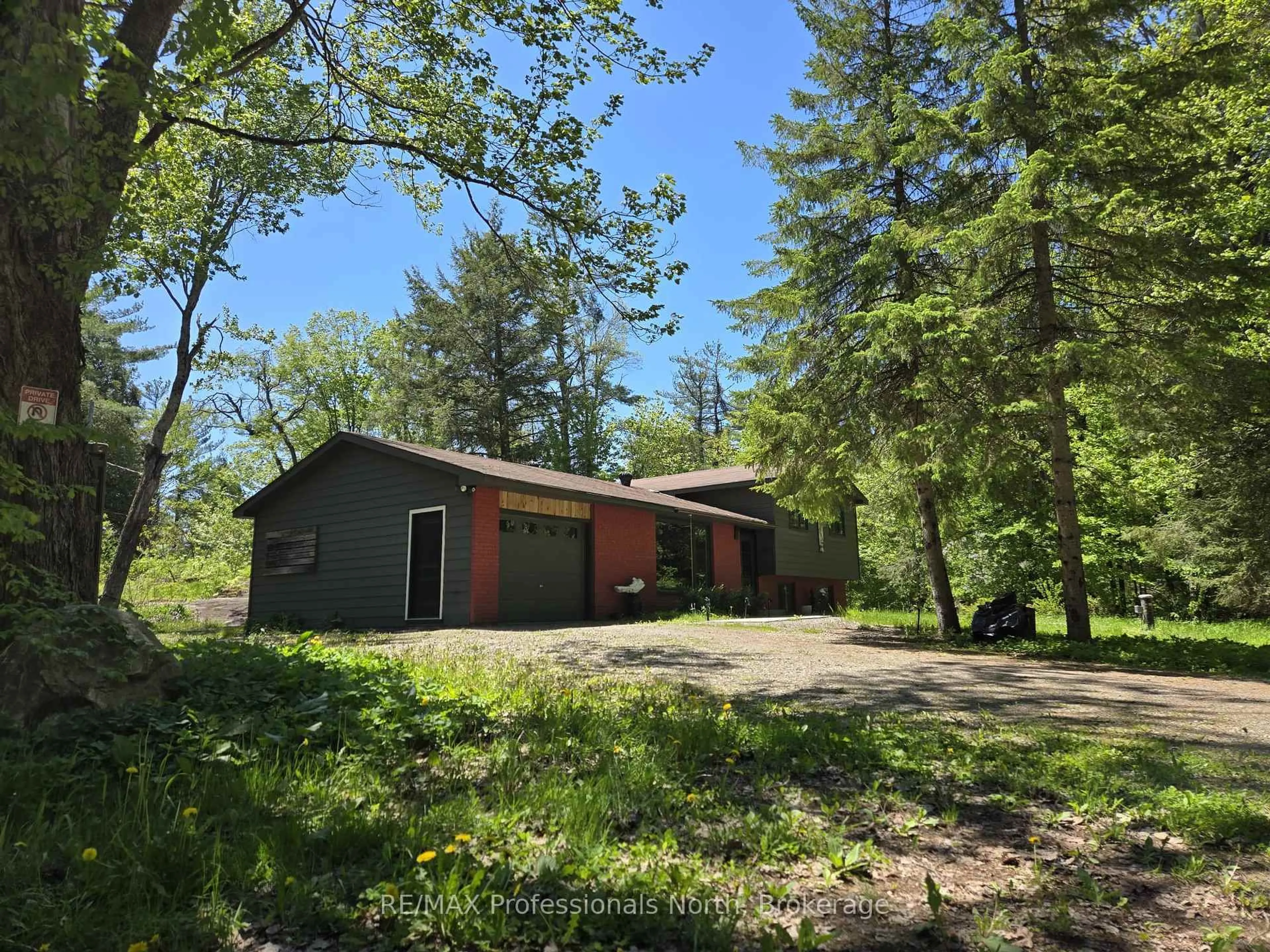 A pic from outside/outdoor area/front of a property/back of a property/a pic from drone, forest/trees view for 1460 Peterson Rd, Bracebridge Ontario P1L 1X1