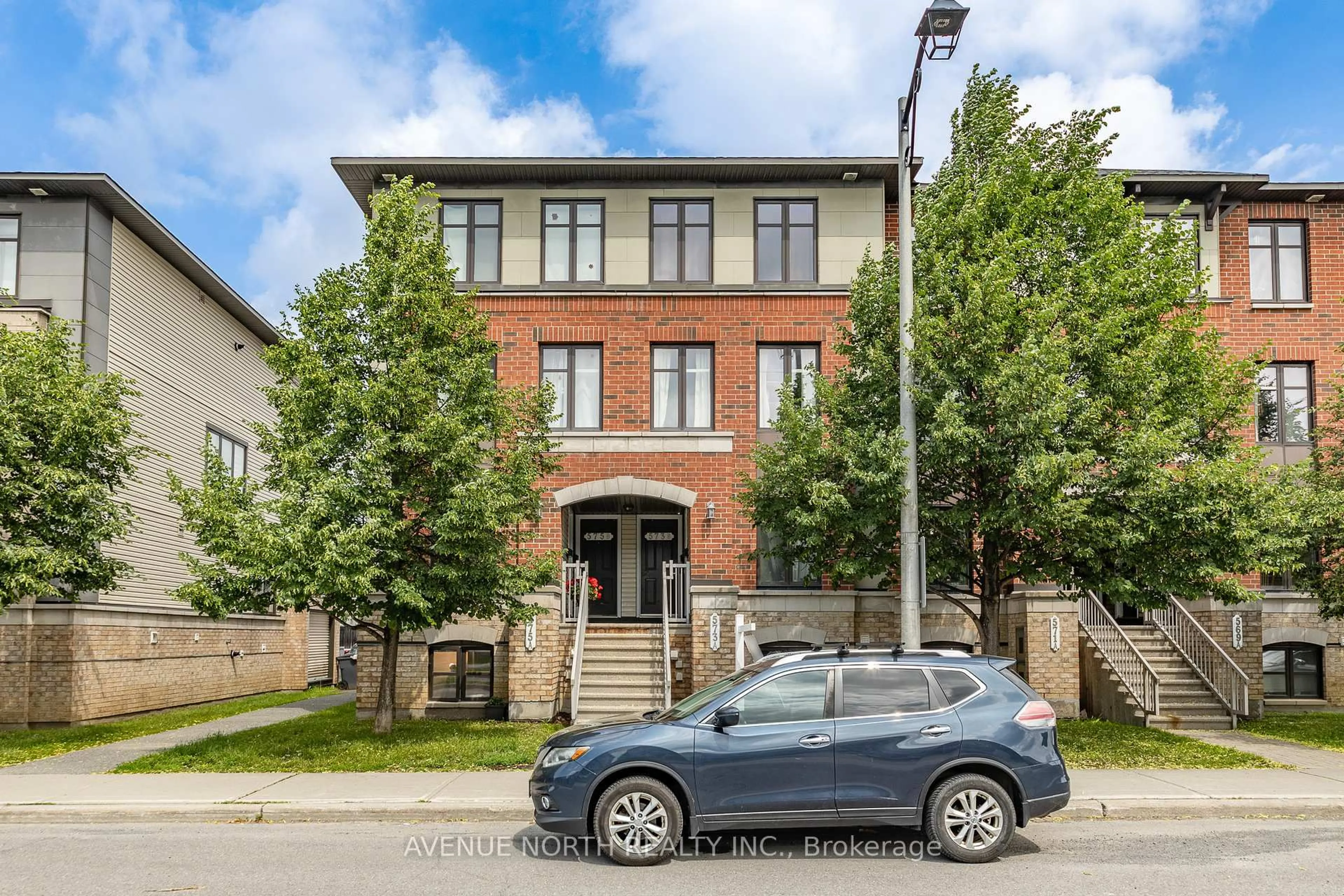 Home with brick exterior material, street for 573B Chapman Mills Dr, Ottawa Ontario K2J 5T2