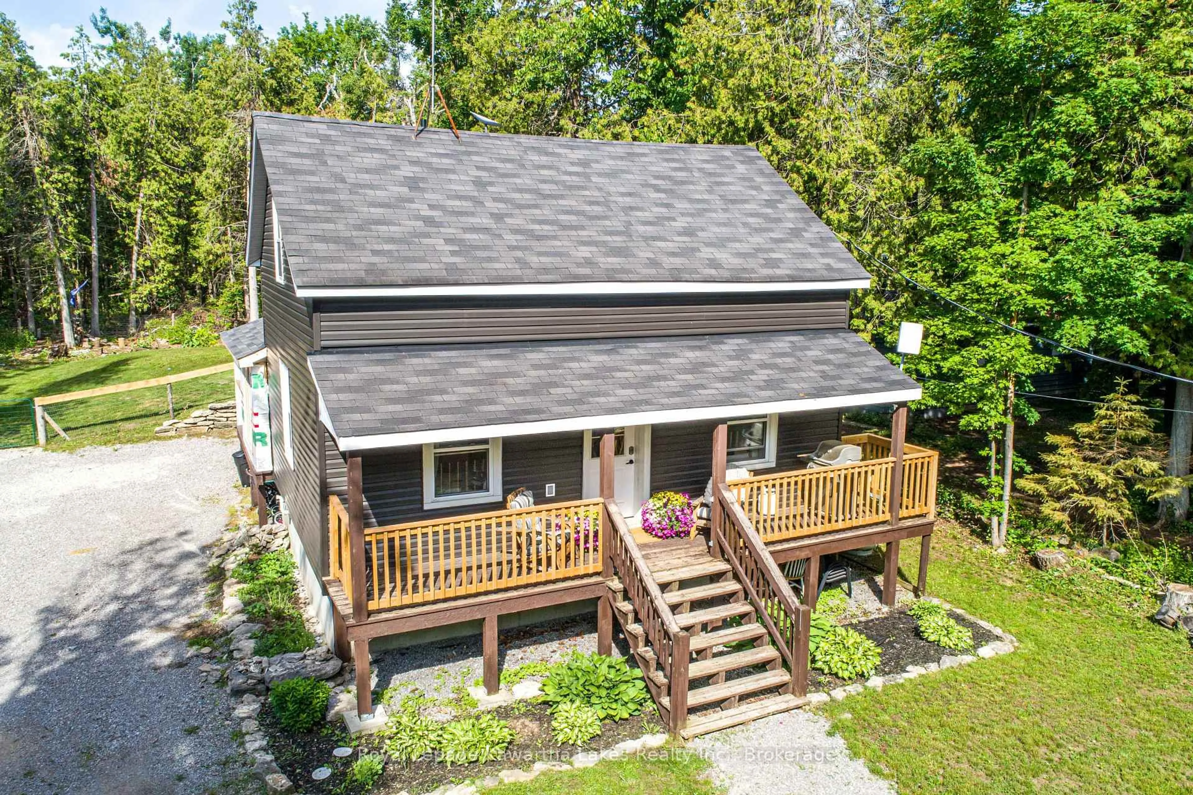 A pic from outside/outdoor area/front of a property/back of a property/a pic from drone, street for 112 Echo Bay Rd, Kawartha Lakes Ontario K0M 1A0