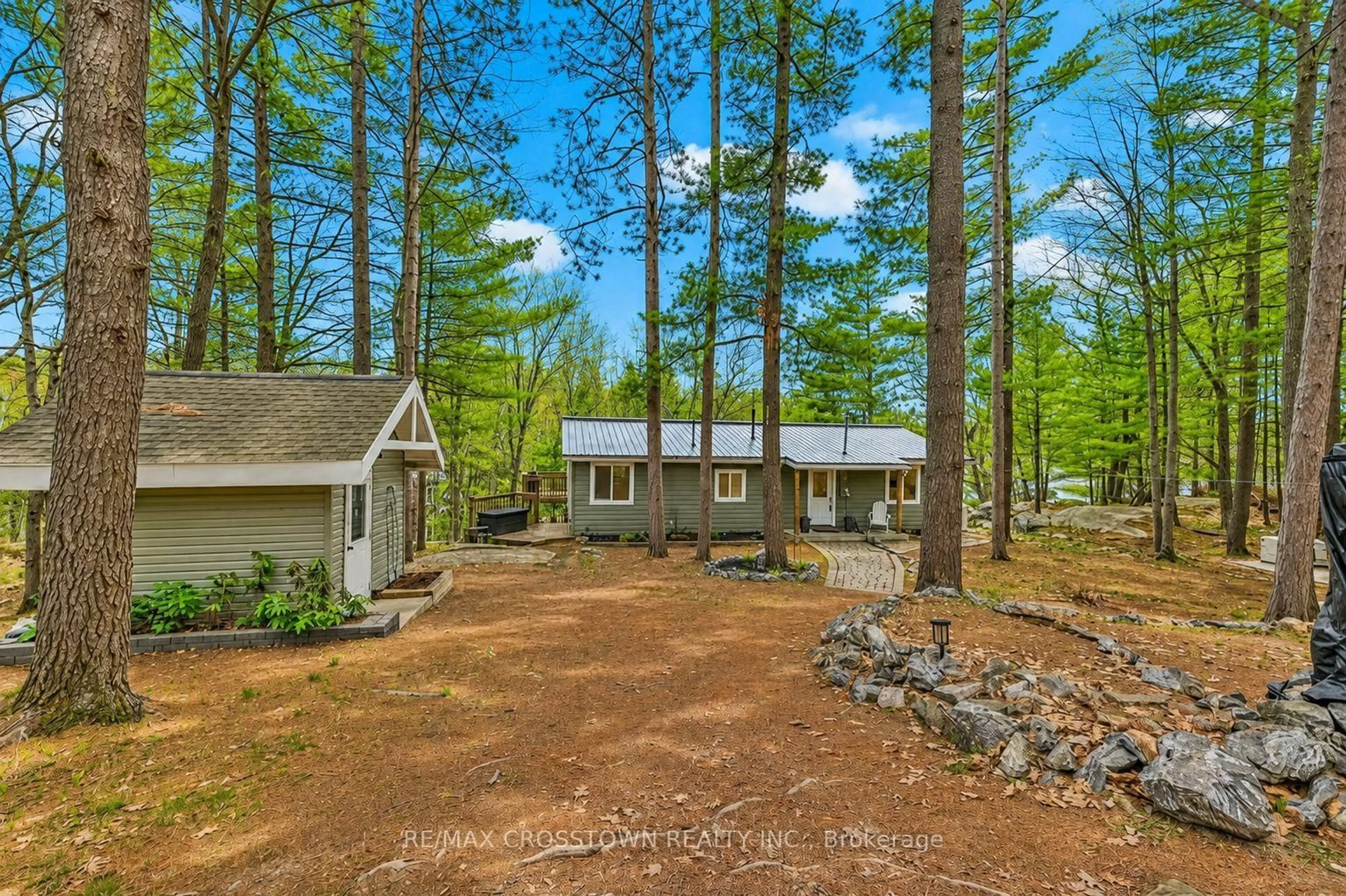 A pic from outside/outdoor area/front of a property/back of a property/a pic from drone, forest/trees view for 607 Juniper Dr, Gravenhurst Ontario P1P 1R1