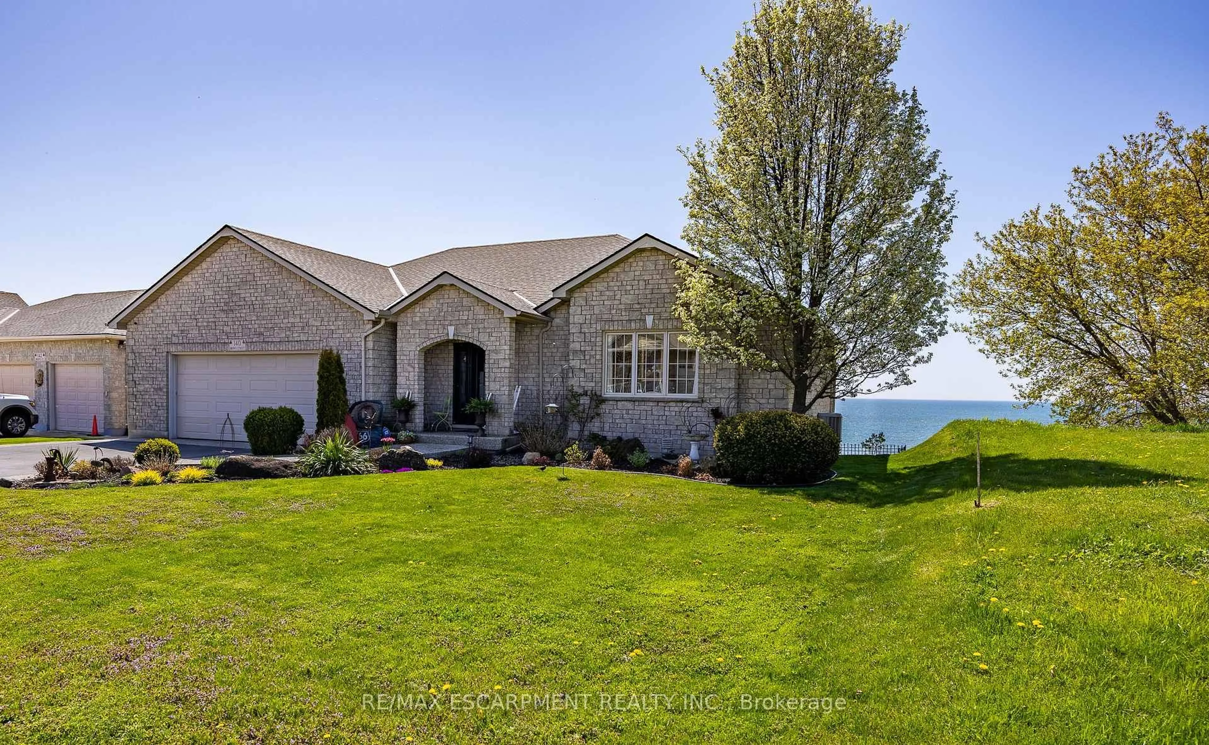 A pic from outside/outdoor area/front of a property/back of a property/a pic from drone, water/lake/river/ocean view for 140 Brown St, Norfolk Ontario N0A 1N7