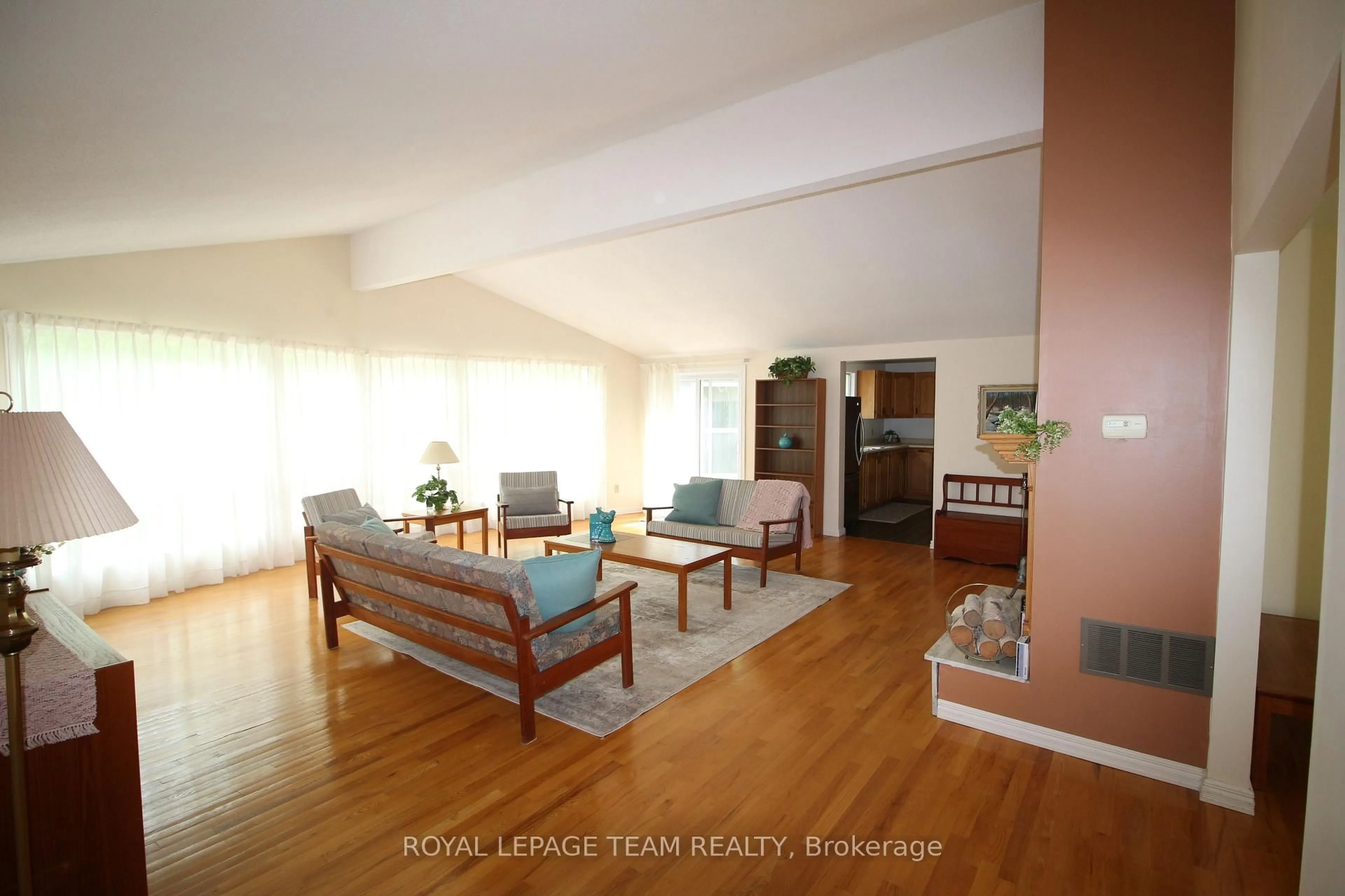 Living room with furniture, wood/laminate floor for 214 Arcand Rd, North Grenville Ontario K0G 1J0