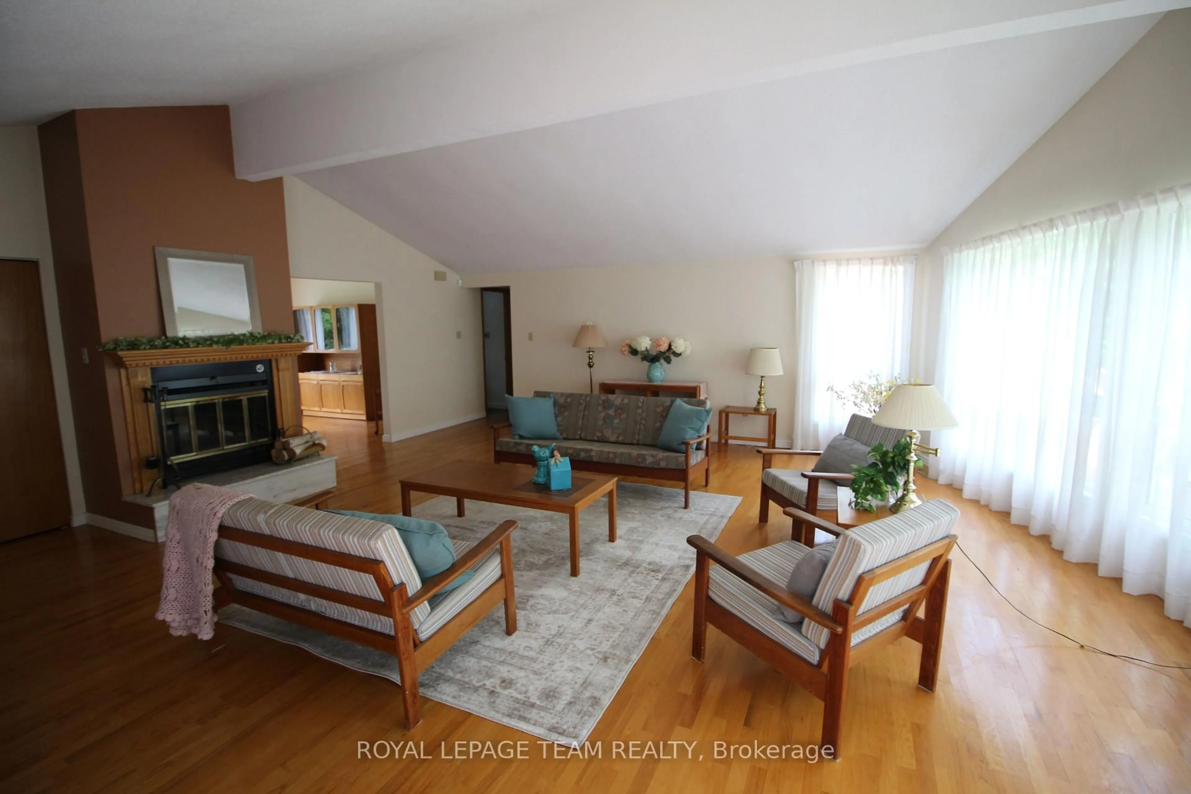 Living room with furniture, wood/laminate floor for 214 Arcand Rd, North Grenville Ontario K0G 1J0