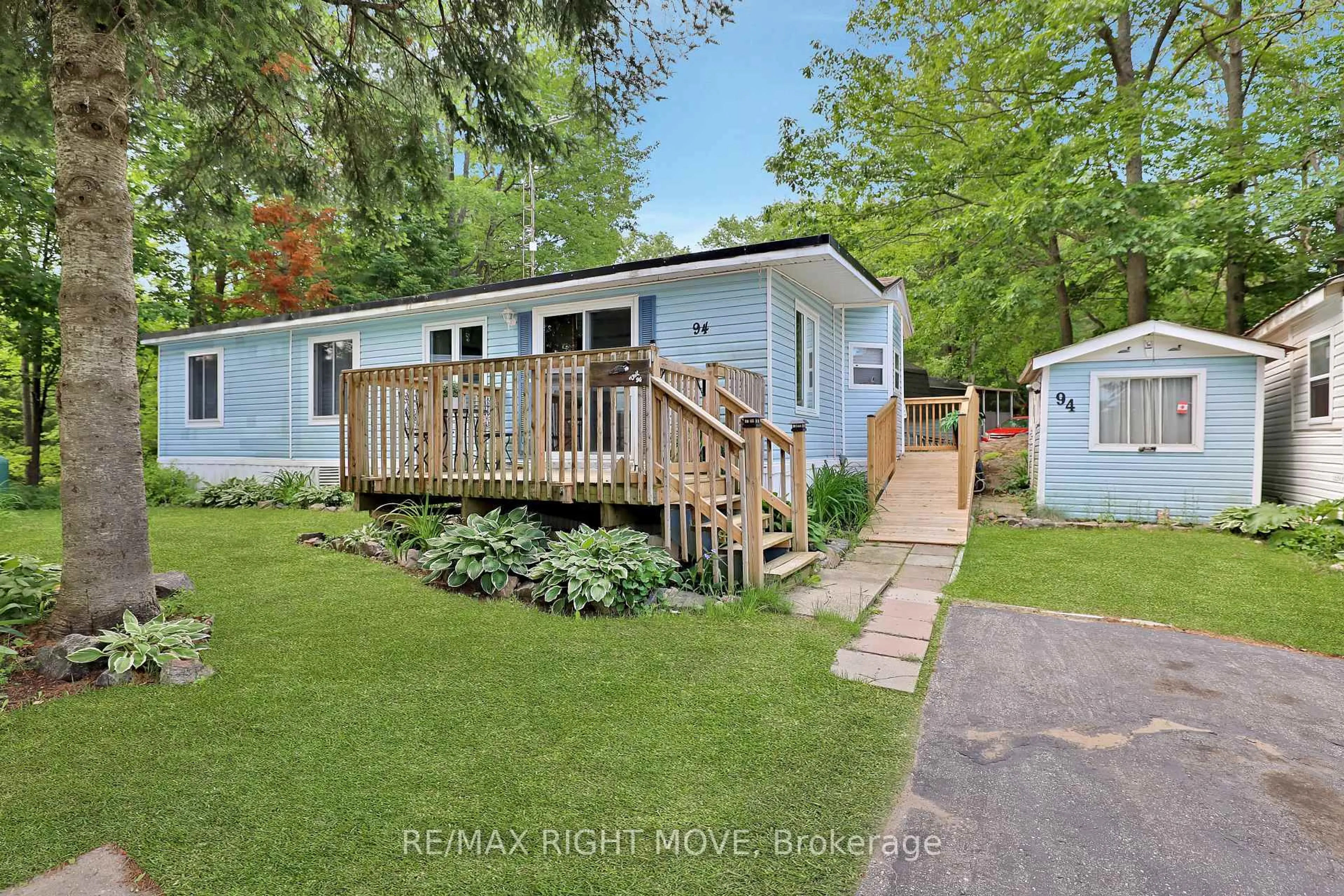 A pic from outside/outdoor area/front of a property/back of a property/a pic from drone, street for 1007 Racoon Rd #94, Gravenhurst Ontario P1P 0C5