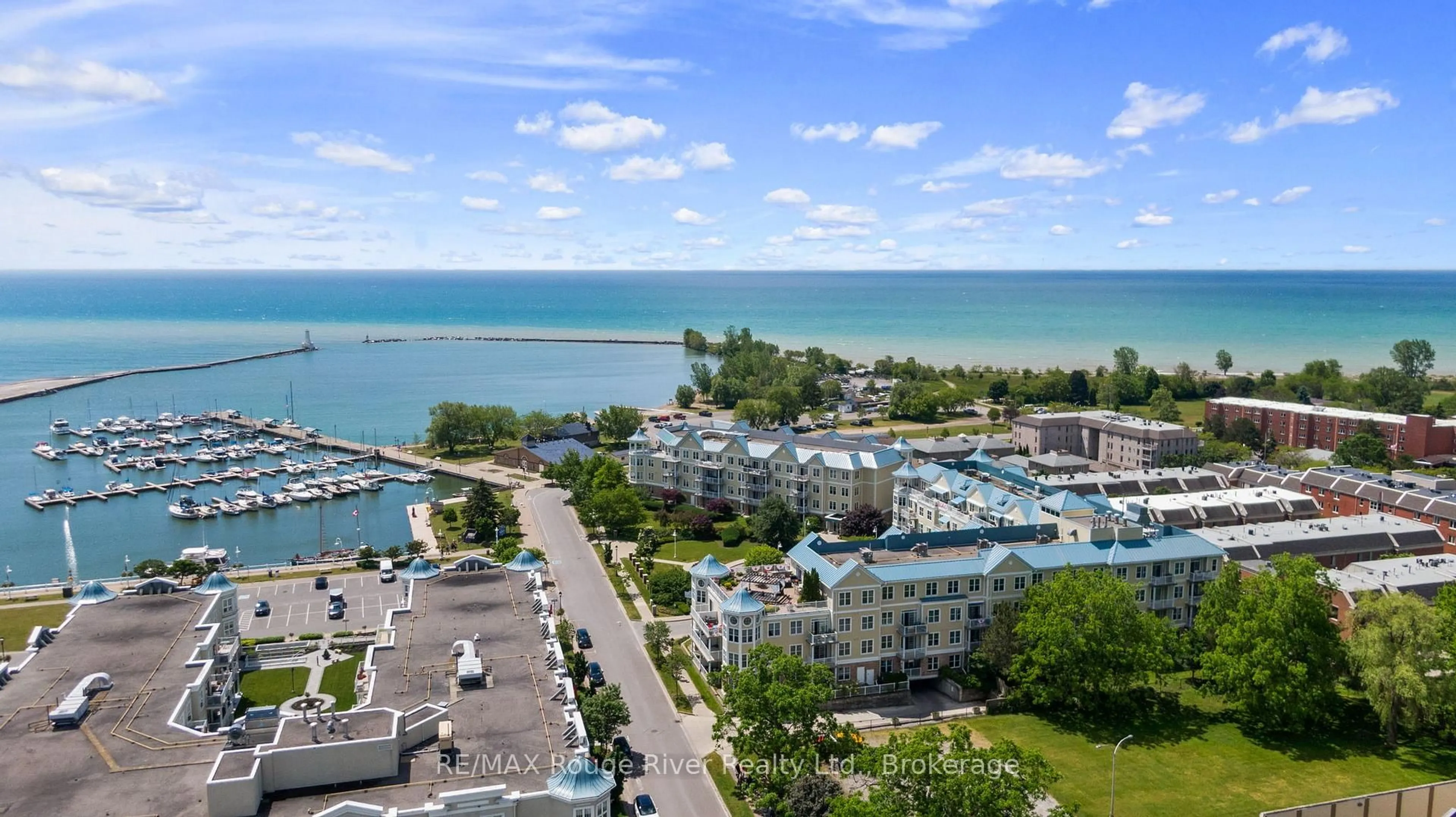 A pic from outside/outdoor area/front of a property/back of a property/a pic from drone, water/lake/river/ocean view for 145 Third St #102, Cobourg Ontario K9A 5X1