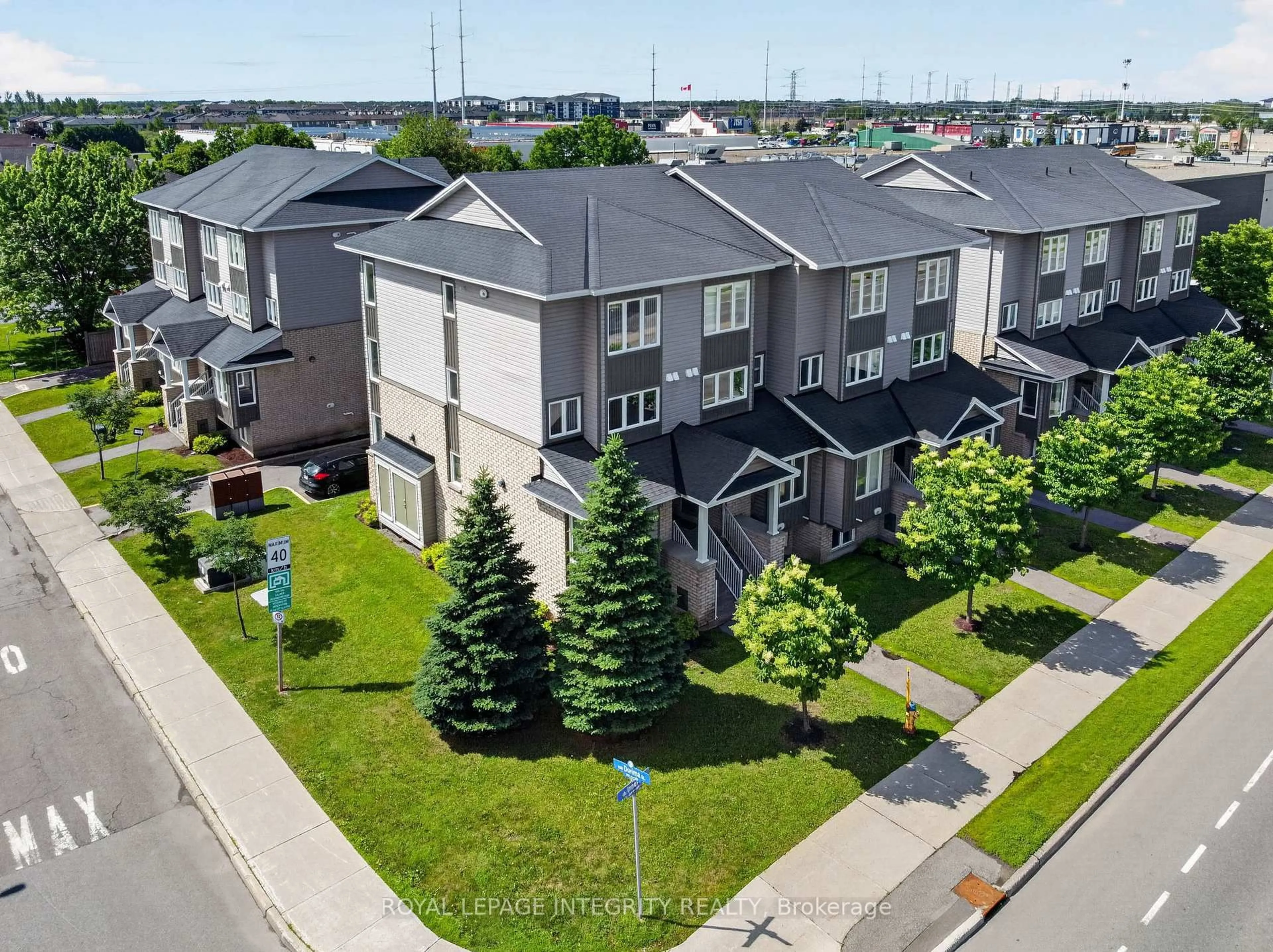 A pic from outside/outdoor area/front of a property/back of a property/a pic from drone, street for 4528 Innes Rd #C, Ottawa Ontario K4A 0X5