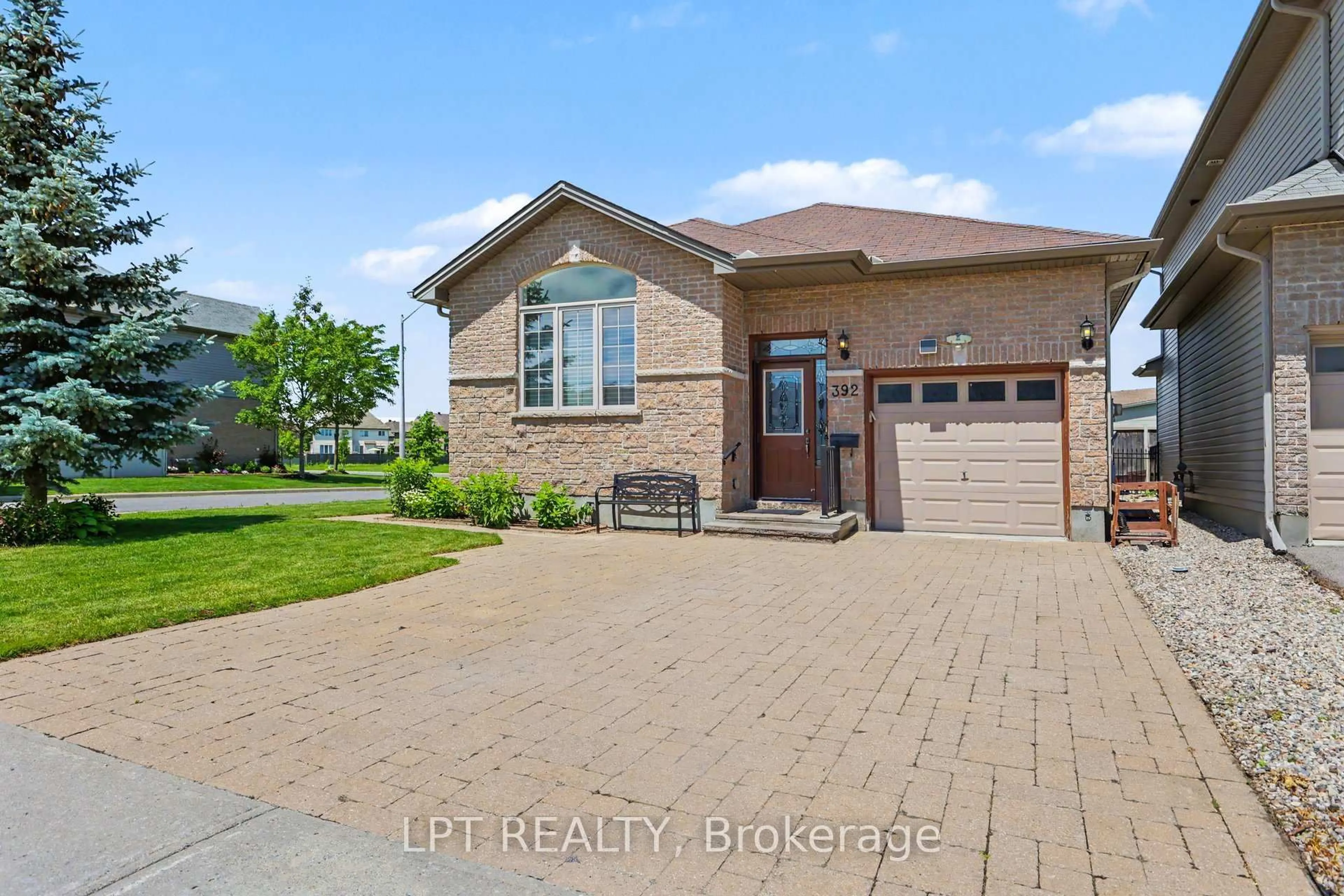 Home with brick exterior material, street for 392 Bamburgh Way, Ottawa Ontario K2J 6A6