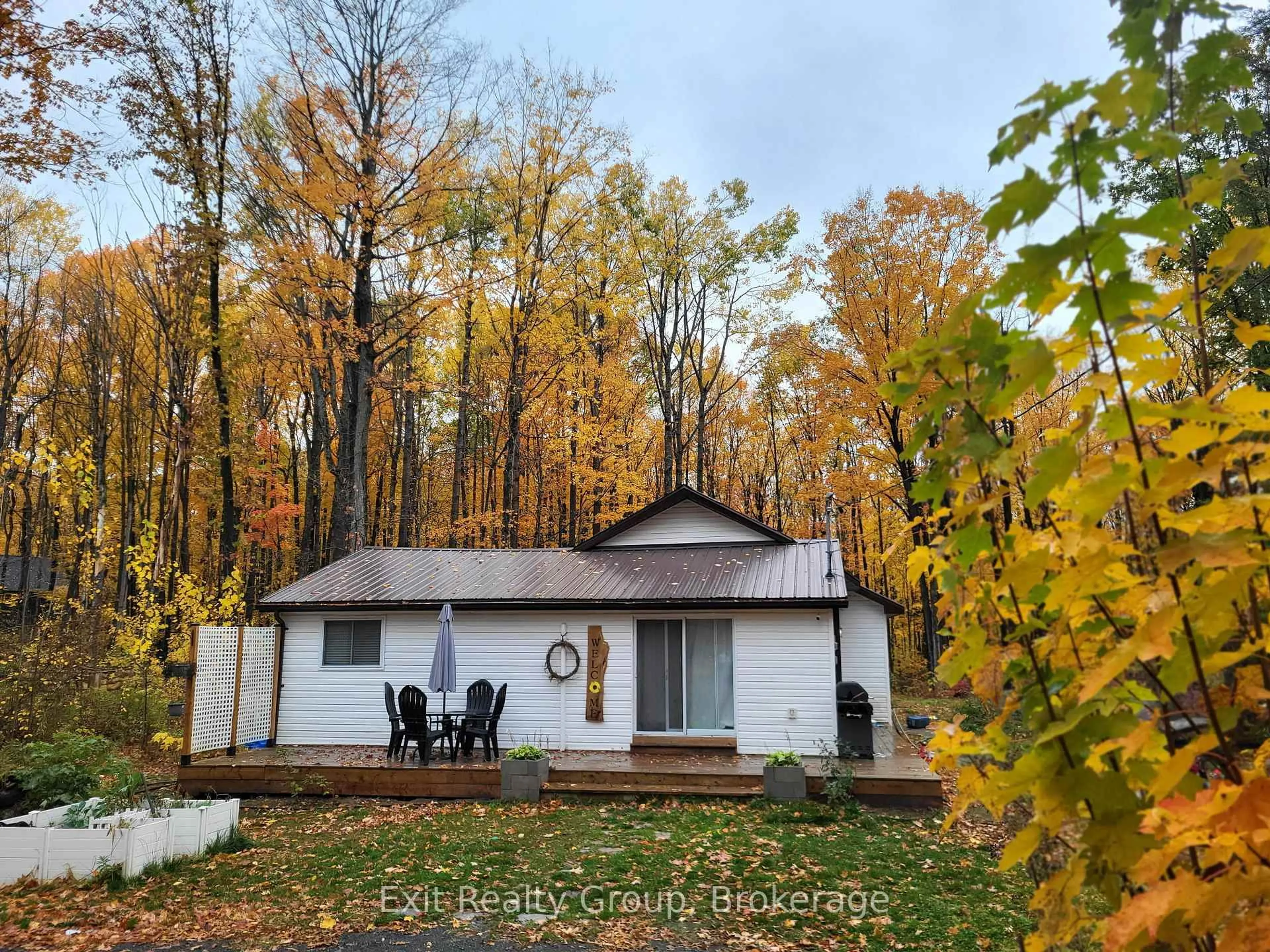 A pic from outside/outdoor area/front of a property/back of a property/a pic from drone, forest/trees view for 54 Paradise Rd, Limoges Ontario K0K 2M0