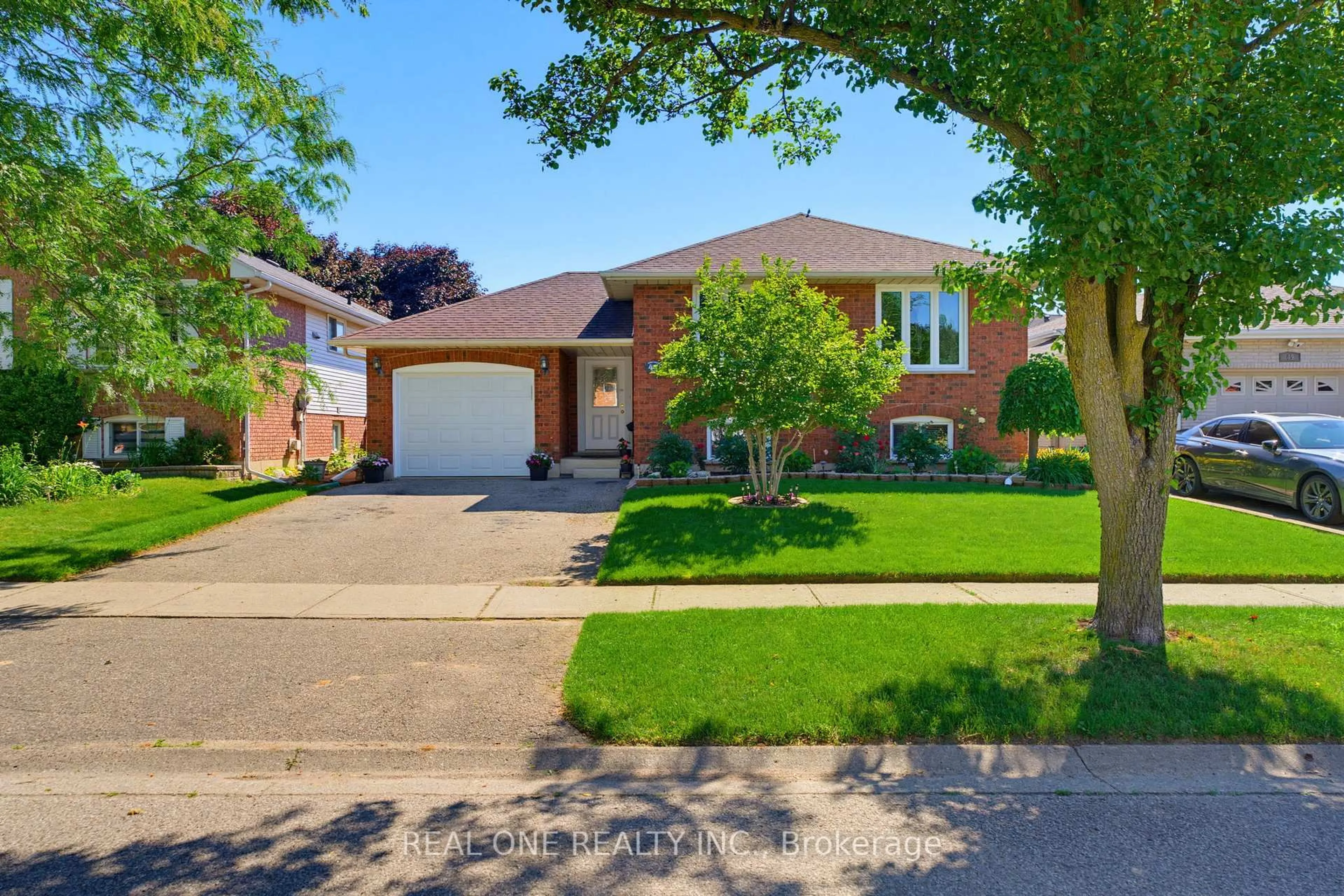 Home with brick exterior material, street for 47 Trillium Way, Brantford Ontario N3R 7T8
