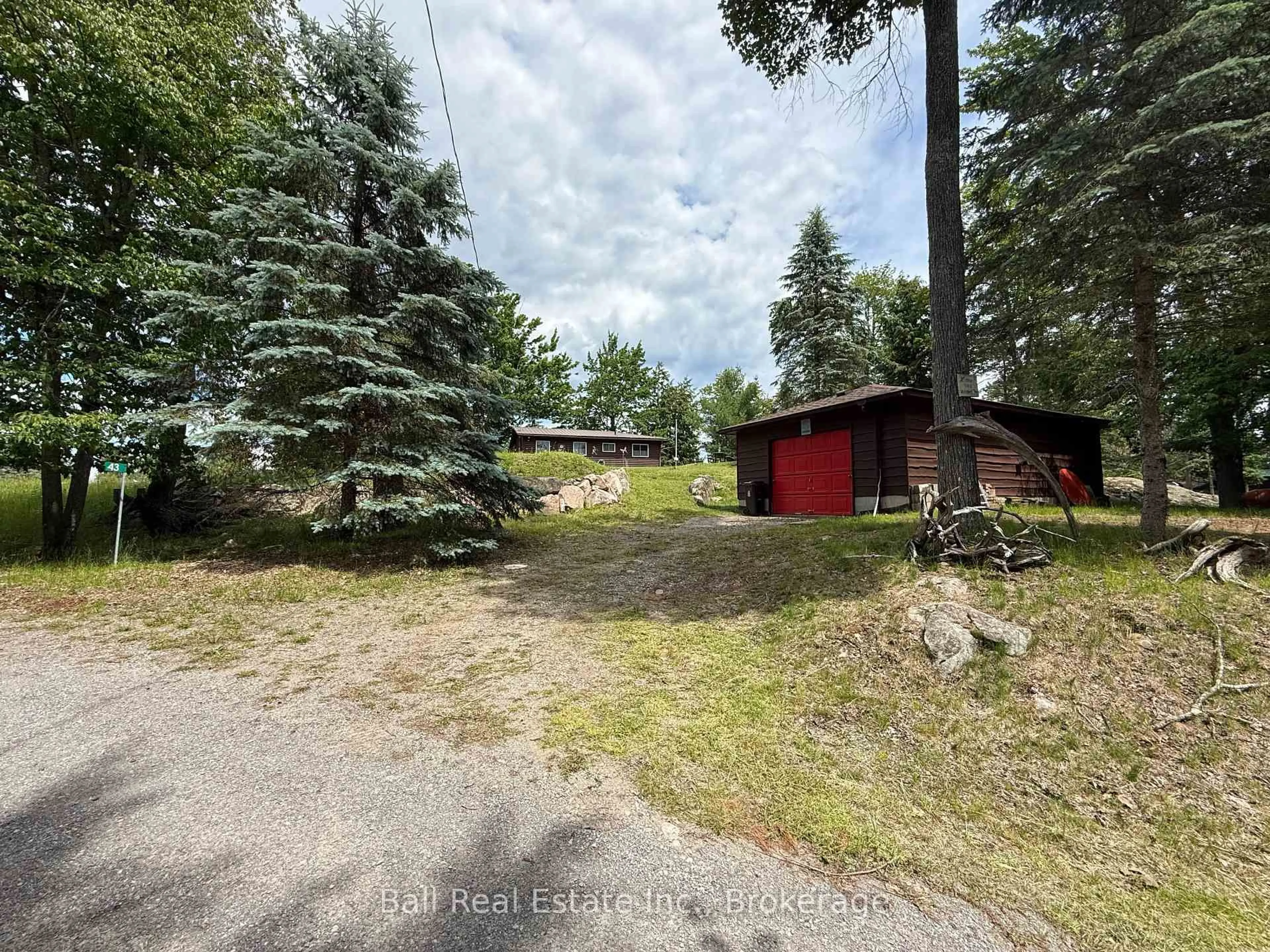 A pic from outside/outdoor area/front of a property/back of a property/a pic from drone, forest/trees view for 43 Fire Route 52A, North Kawartha Ontario K0L 1A0