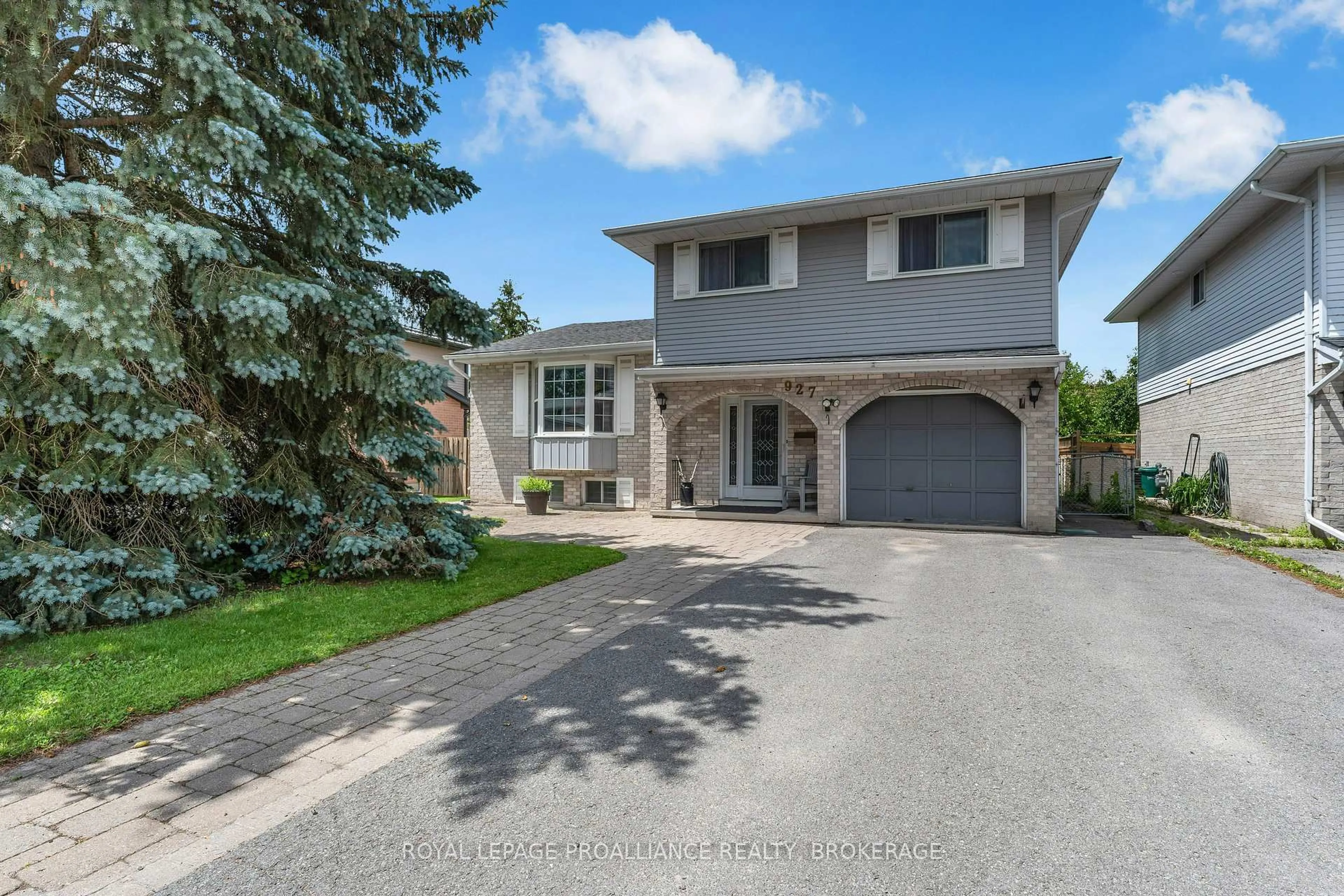 Home with brick exterior material, street for 927 Newhall Dr, Kingston Ontario K7P 2C5