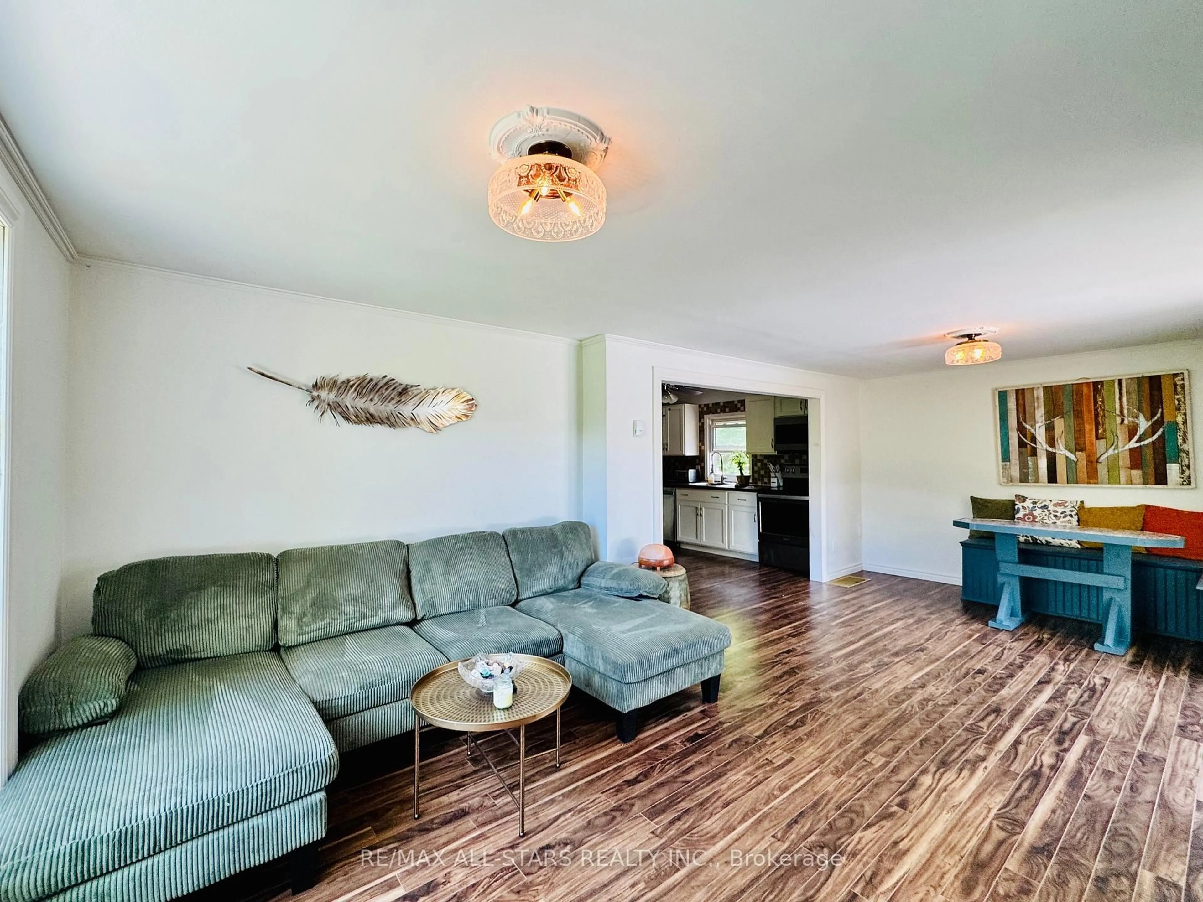 Living room with furniture, wood/laminate floor for 9 Pritchard Rd, Combermere Ontario K0J 1L0