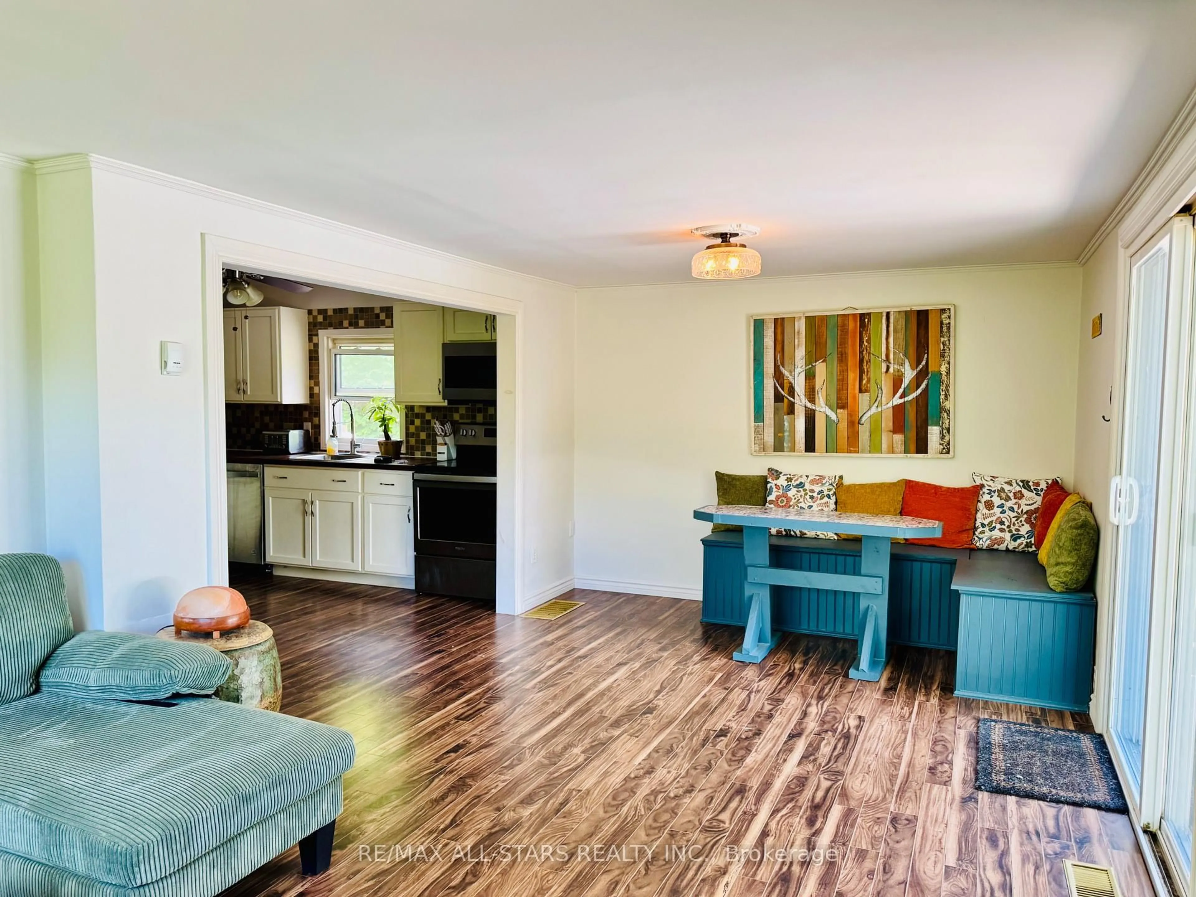 Living room with furniture, wood/laminate floor for 9 Pritchard Rd, Combermere Ontario K0J 1L0