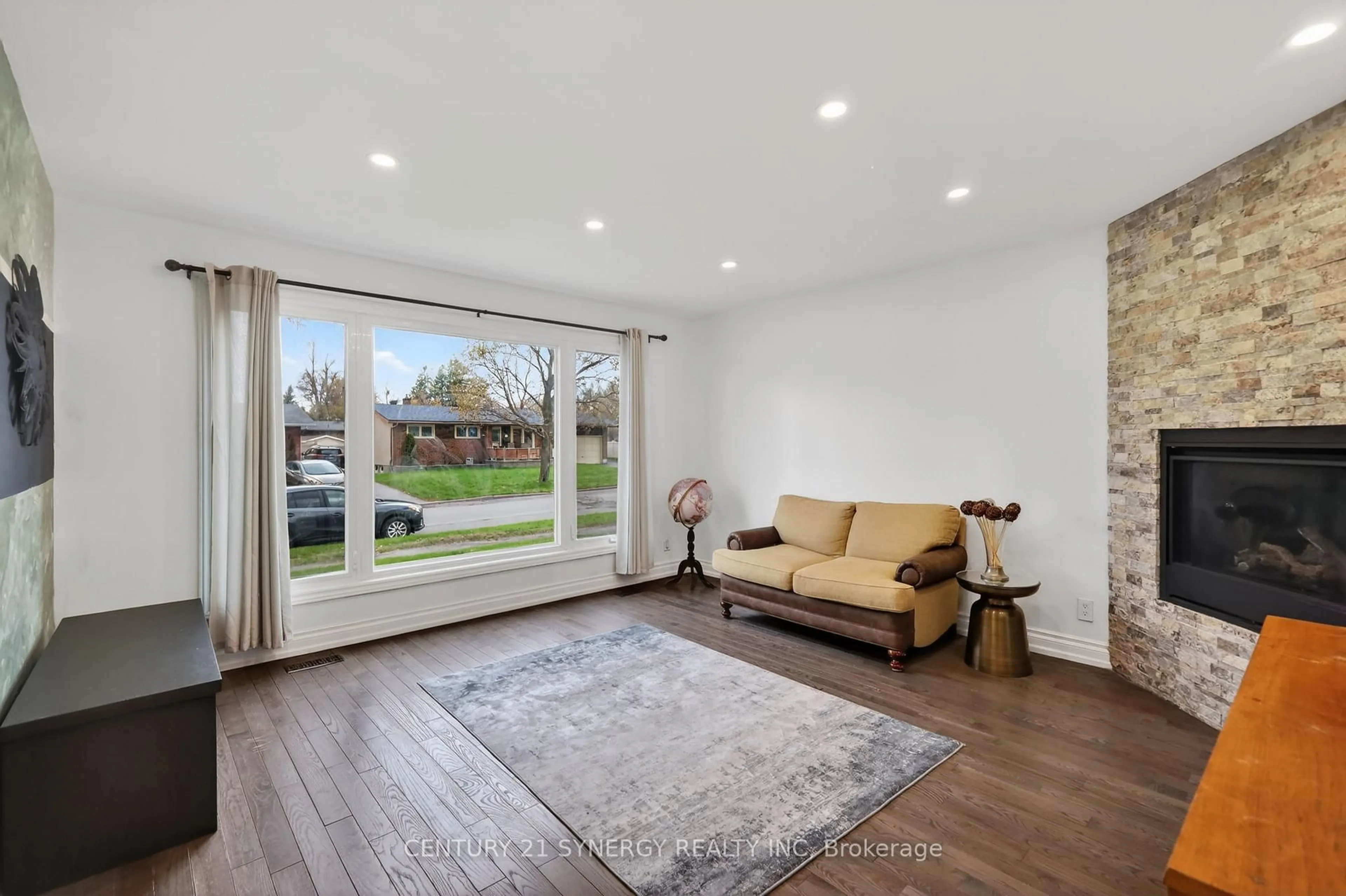 Living room with furniture, wood/laminate floor for 2358 Joliffe St, Ottawa Ontario K1G 1H2