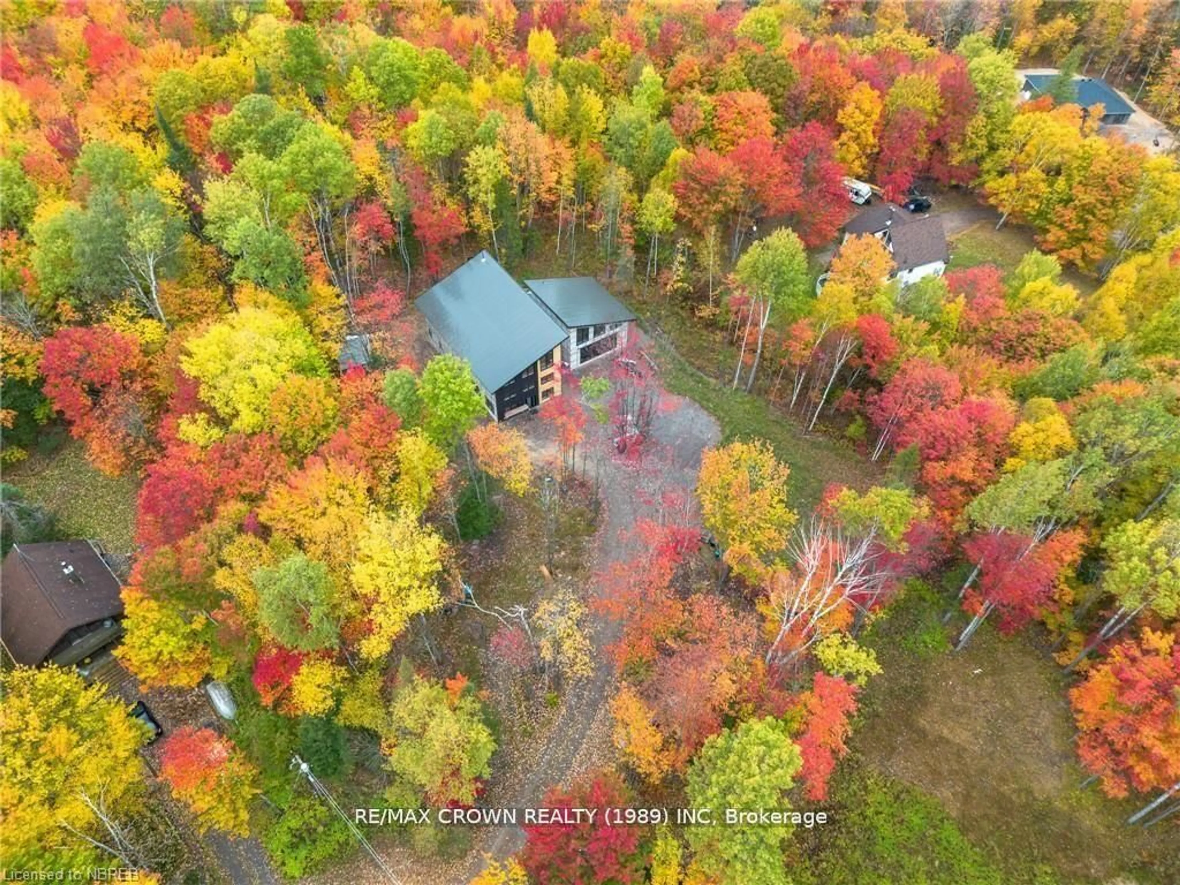 A pic from outside/outdoor area/front of a property/back of a property/a pic from drone, forest/trees view for 24 Sun Valley Way, Nipissing Ontario P0H 1Z0