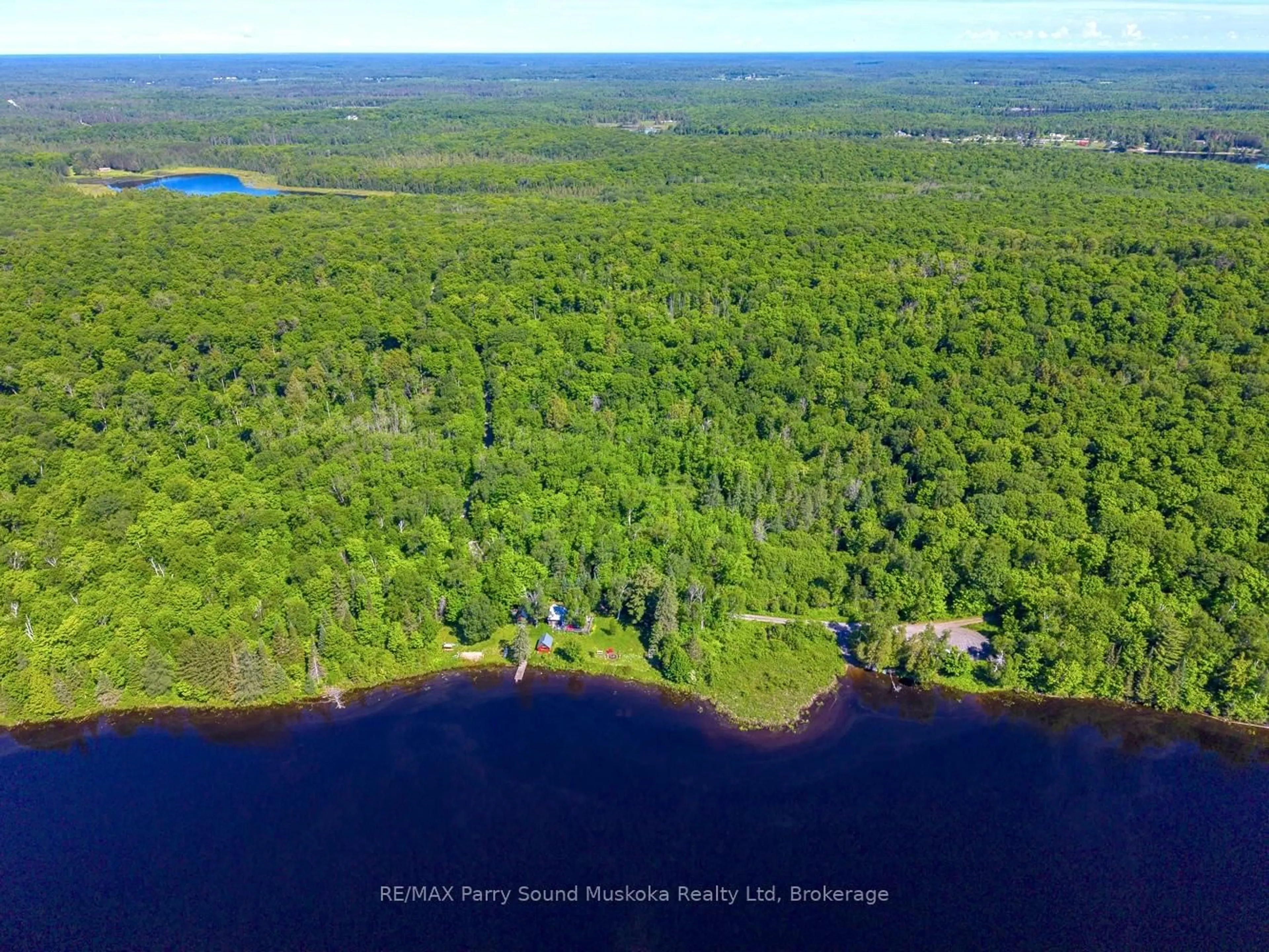 A pic from outside/outdoor area/front of a property/back of a property/a pic from drone, water/lake/river/ocean view for 472 Long Lake Rd, Parry Sound Remote Area Ontario P0H 1A0