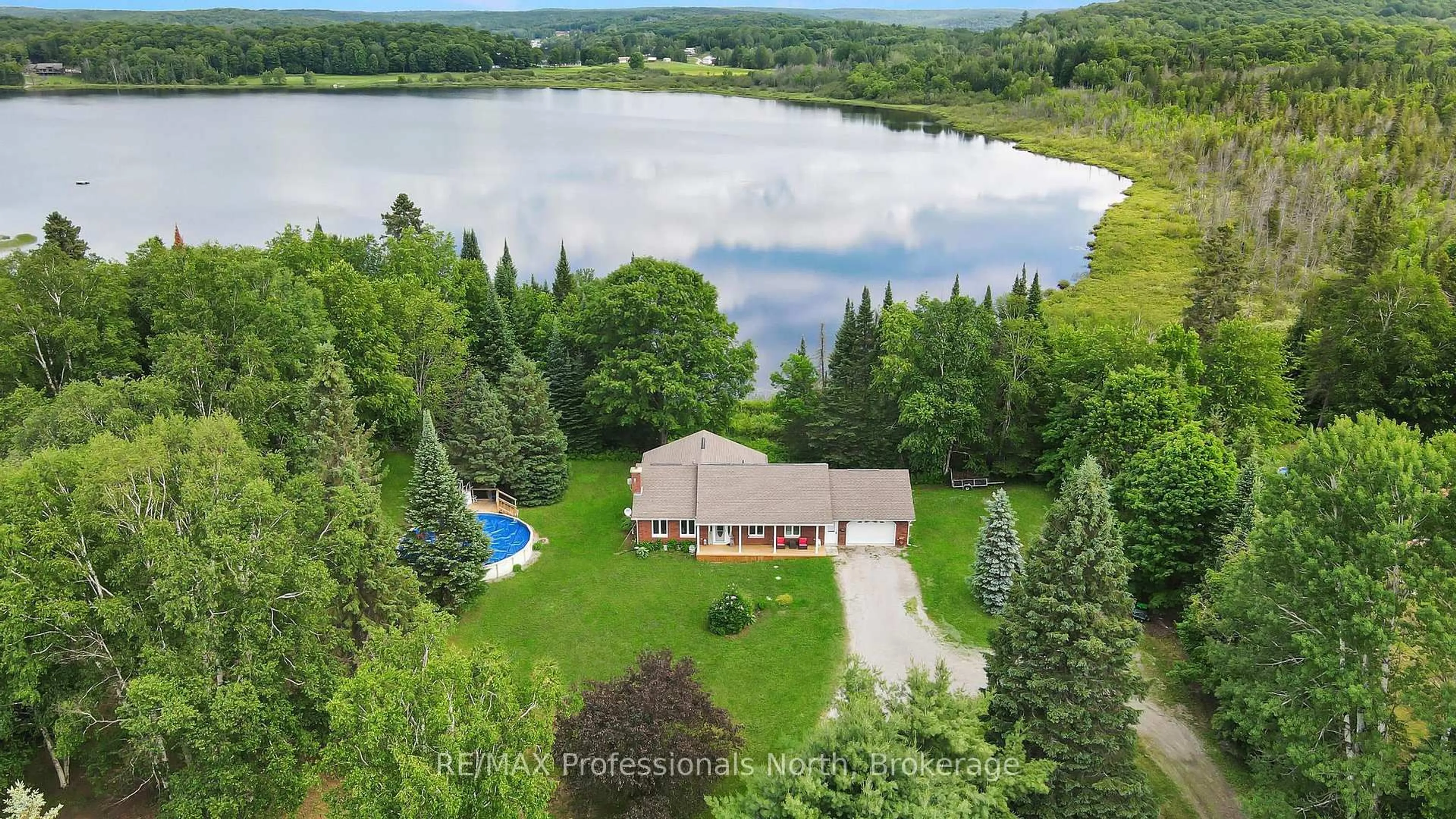 A pic from outside/outdoor area/front of a property/back of a property/a pic from drone, water/lake/river/ocean view for 1187 WOODS Rd, Dysart et al Ontario K0M 1S0