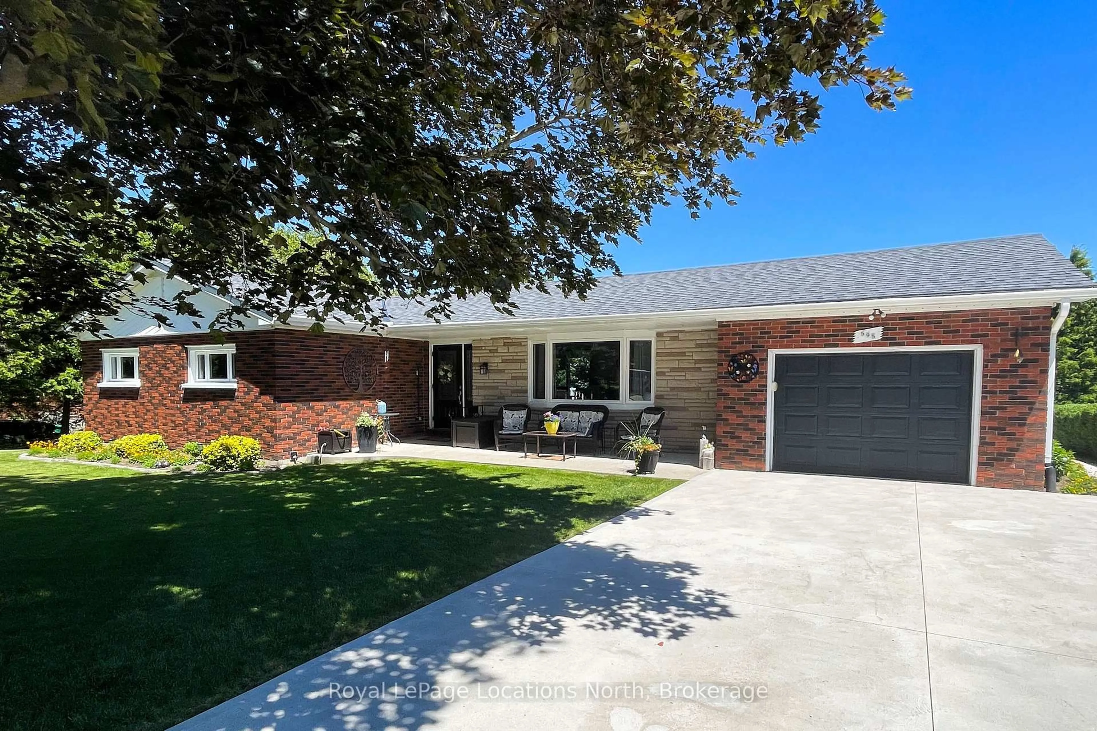 Home with brick exterior material, street for 595 Ridge Rd, Meaford Ontario N4L 1L9