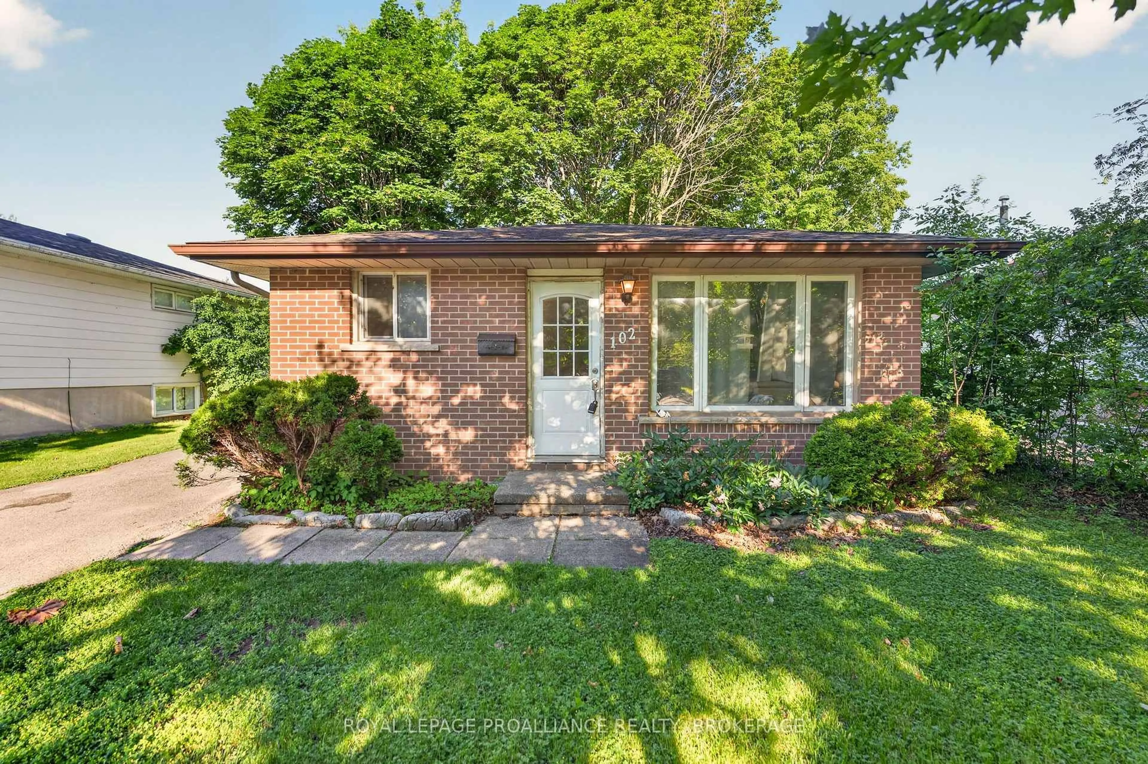 Home with brick exterior material, street for 102 Calderwood Dr, Kingston Ontario K7M 6M3