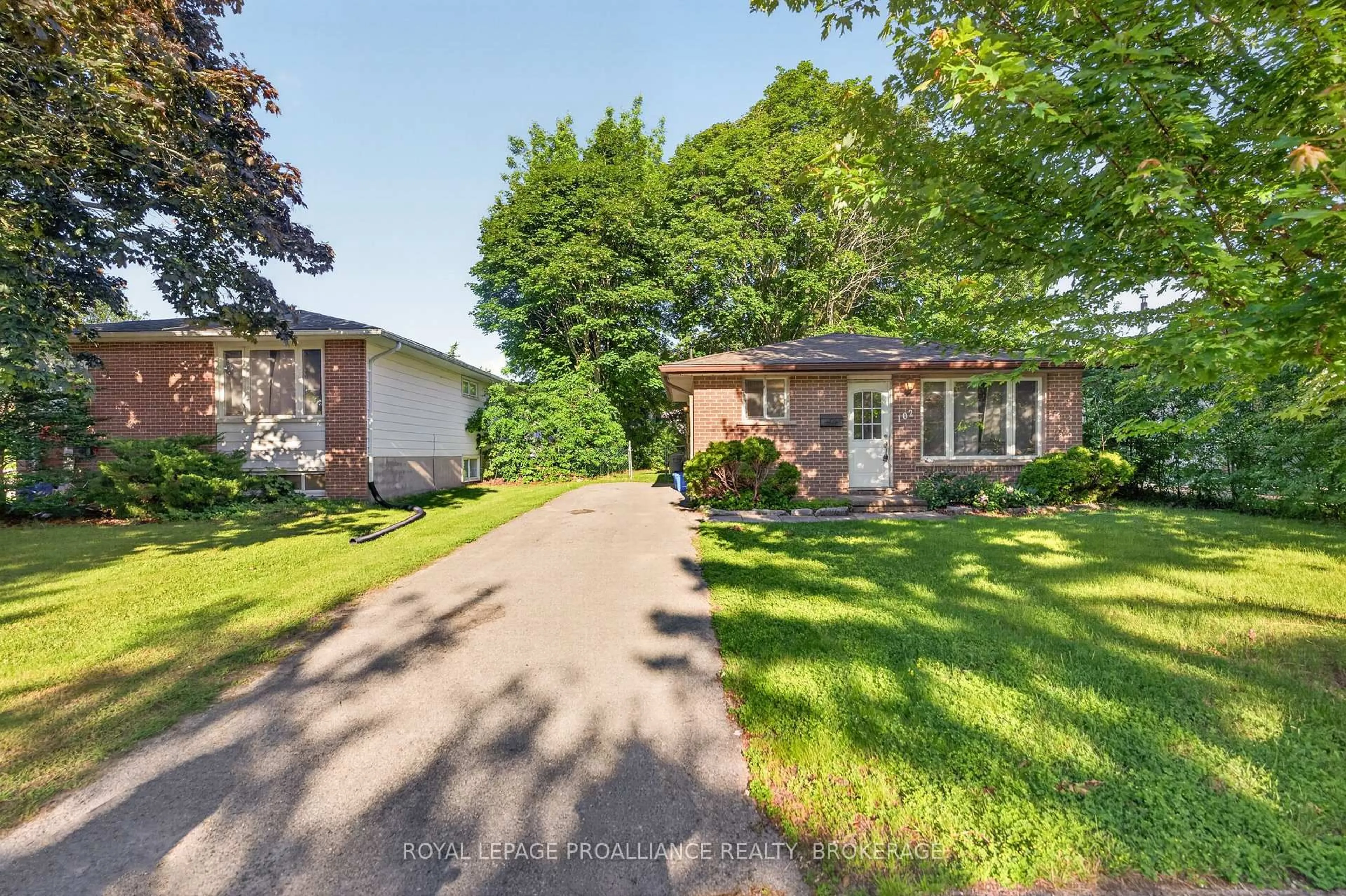 A pic from outside/outdoor area/front of a property/back of a property/a pic from drone, street for 102 Calderwood Dr, Kingston Ontario K7M 6M3