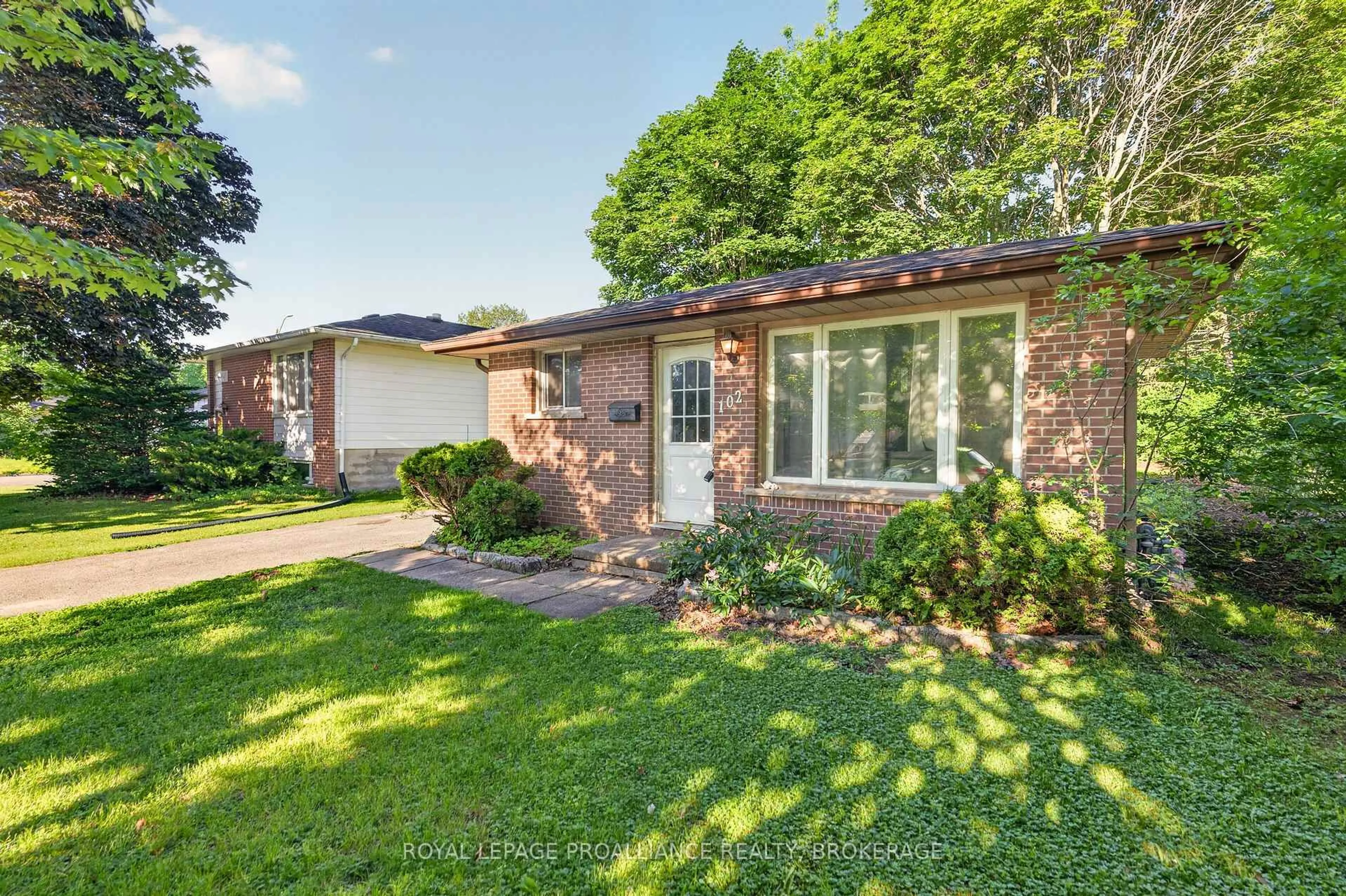 Home with brick exterior material, street for 102 Calderwood Dr, Kingston Ontario K7M 6M3