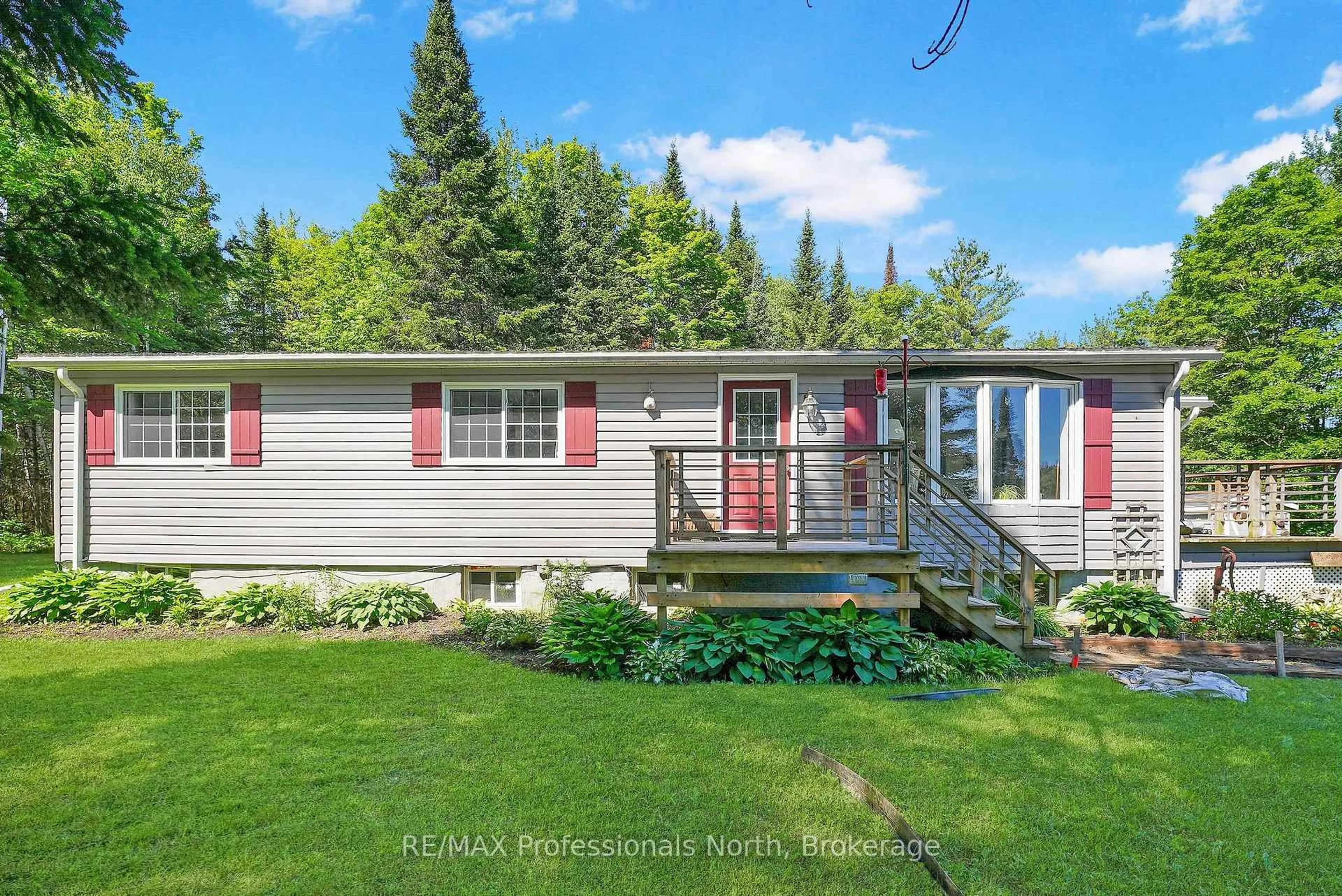 A pic from outside/outdoor area/front of a property/back of a property/a pic from drone, street for 3389 Gelert Rd, Minden Hills Ontario K0M 2K0